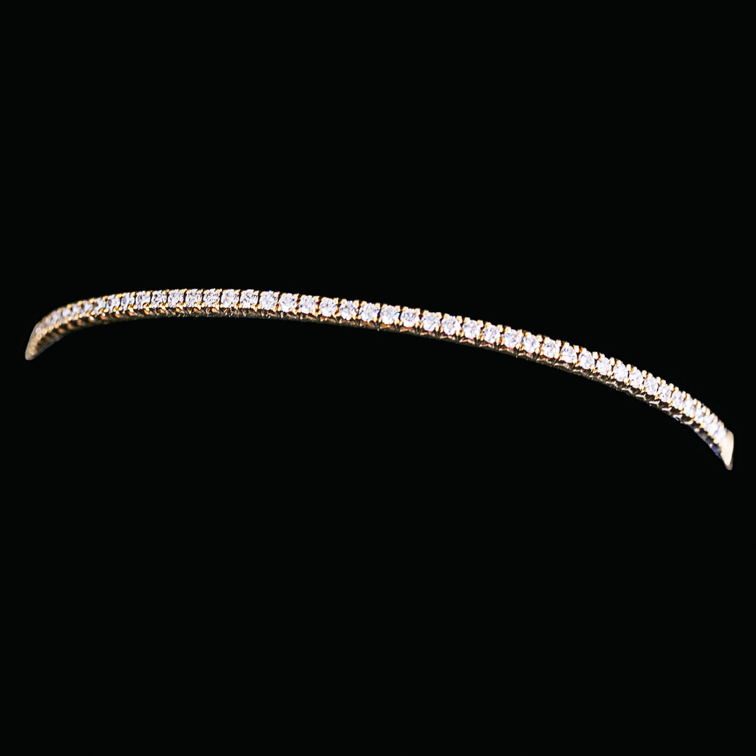 Tiffany & Co. 18K Yellow Gold Natural Diamond Hinged Bracelet: Tiffany & Co. 18K Yellow Gold Natural Diamond Hinged Bracelet, Consisting of Forty-Nine (49) Natural Diamonds Weighing .67 Carat. Diamonds are F in Color and VS in Clarity. Bracelet Weighs 13.76 Grams