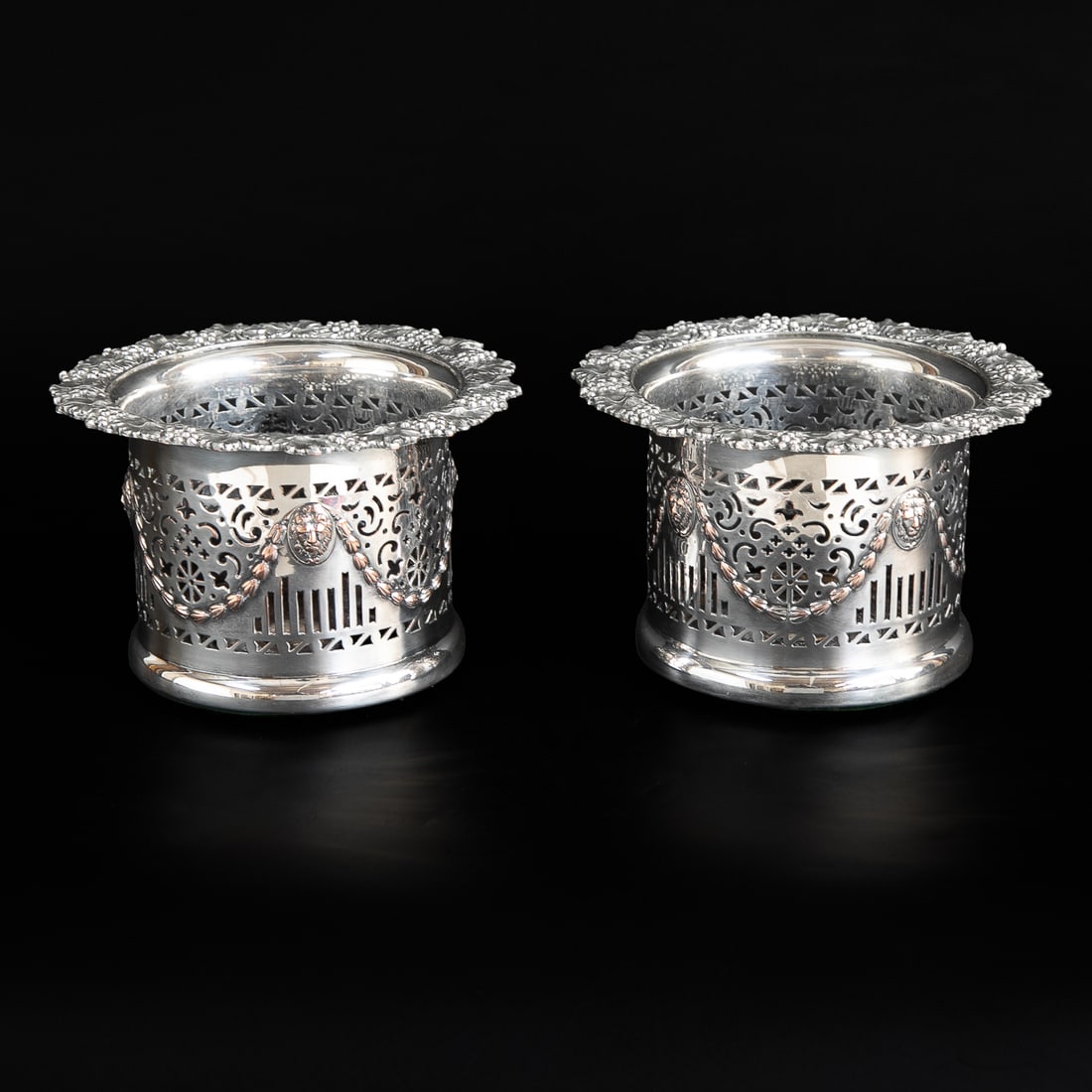 Late 19th C. English Silver Plated Wine Coolers, Pair: Late 19th C. English Silver Plated Wine Coolers, Pair, Having Grapes and Grape Leaves Along Top Edge, Reticulated Sides in Geometric Designs, Featuring Lion Masks and Bell Flower Swags, Ending in