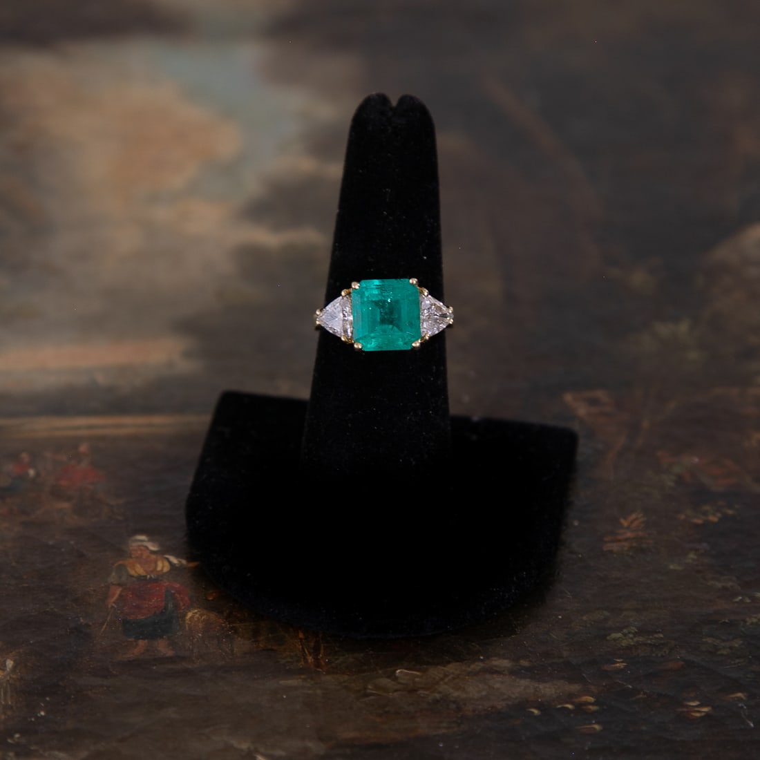 18K Yellow Gold Natural Colombian Emerald and Diamond Ring, Size 7.25: 18K Yellow Gold Natural Colombian Emerald and Diamond Ring, Size 7.25, Consisting of One Emerald-Cut Colombian Emerald Weighing 5.00 Carats and Two Trillion-Cut Diamonds Weighing 1.50 Carats.