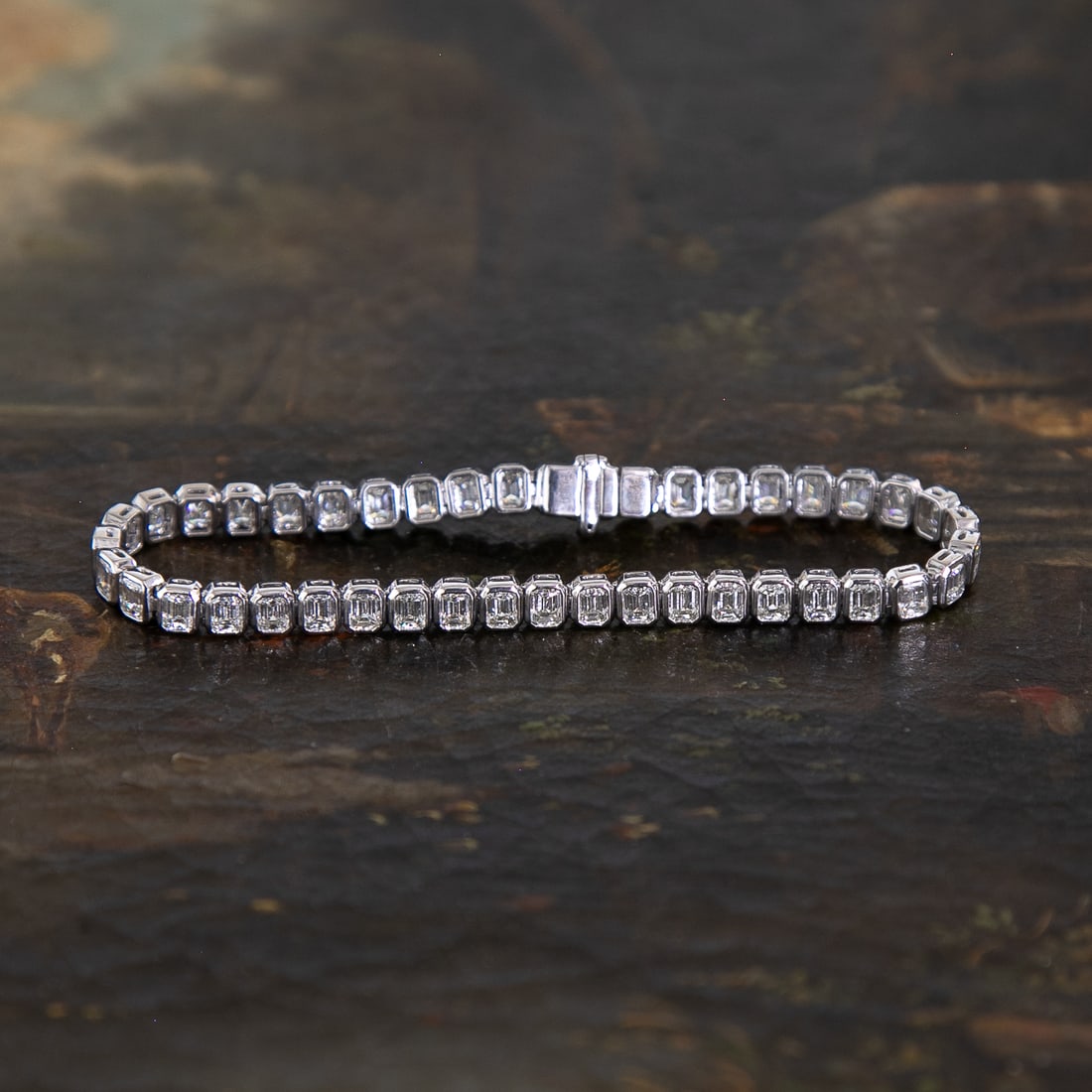 7 Inch Platinum Natural Diamond Bezel Set Bracelet: 7 Inch Platinum Natural Diamond Bezel Set Bracelet, Consisting of Forty-Three (43) Natural Emerald-Cut Diamonds Weighing 8.46 Carats. Diamonds are G-H in Color and VS in Clarity. Bracelet Weighs 20.0