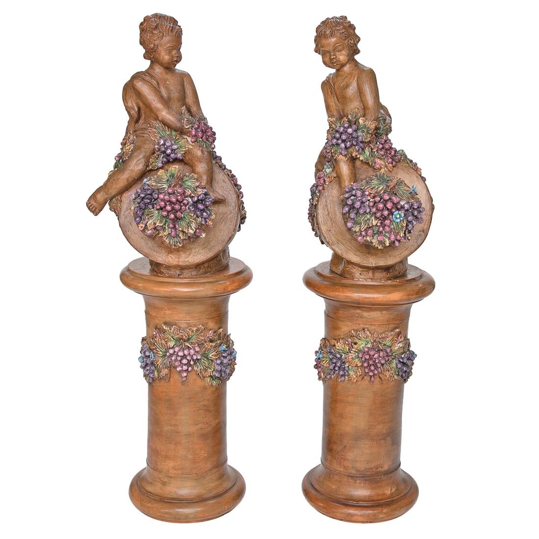 Vintage Italian Terra Cotta Putti Figures with Matching Pedestals, Pair: Vintage Italian Terra Cotta Putti Figures with Matching Pedestals, Pair, Having Natural Finish, Putti Having Draped Cloth, Holding Clusters of Grapes, Sitting on Urn Form Featuring Grape Clusters