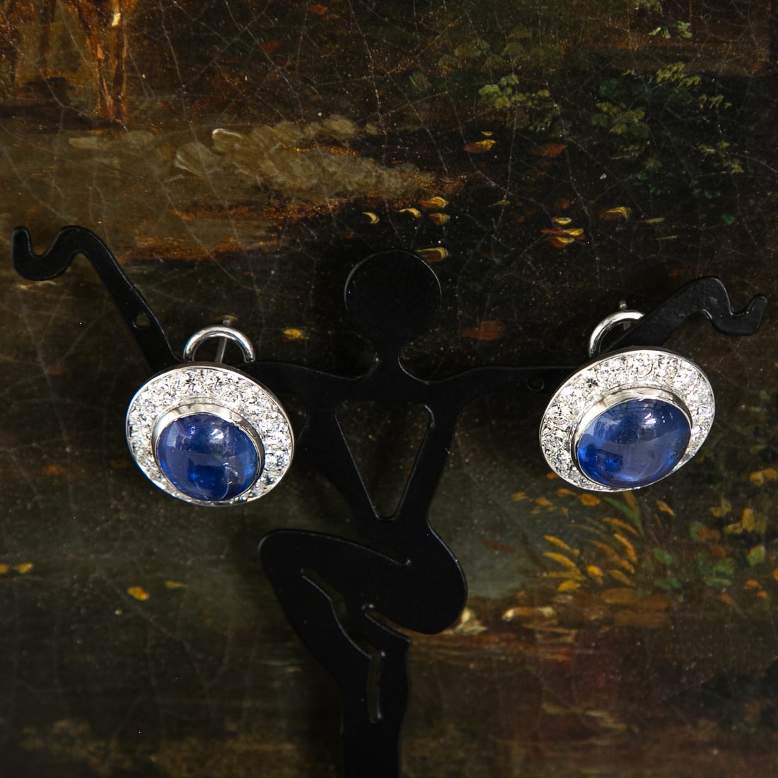 18K White Gold Natural Cabochon Blue Sapphire and Diamond Earrings: 18K White Gold Natural Cabochon Blue Sapphire and Diamond Earrings, Consisting of Two (2) Cabochon Blue Sapphires Weighing 26.50 Carats and 36 Natural Round Brilliant-Cut Diamonds Weighing 3.60 Carats
