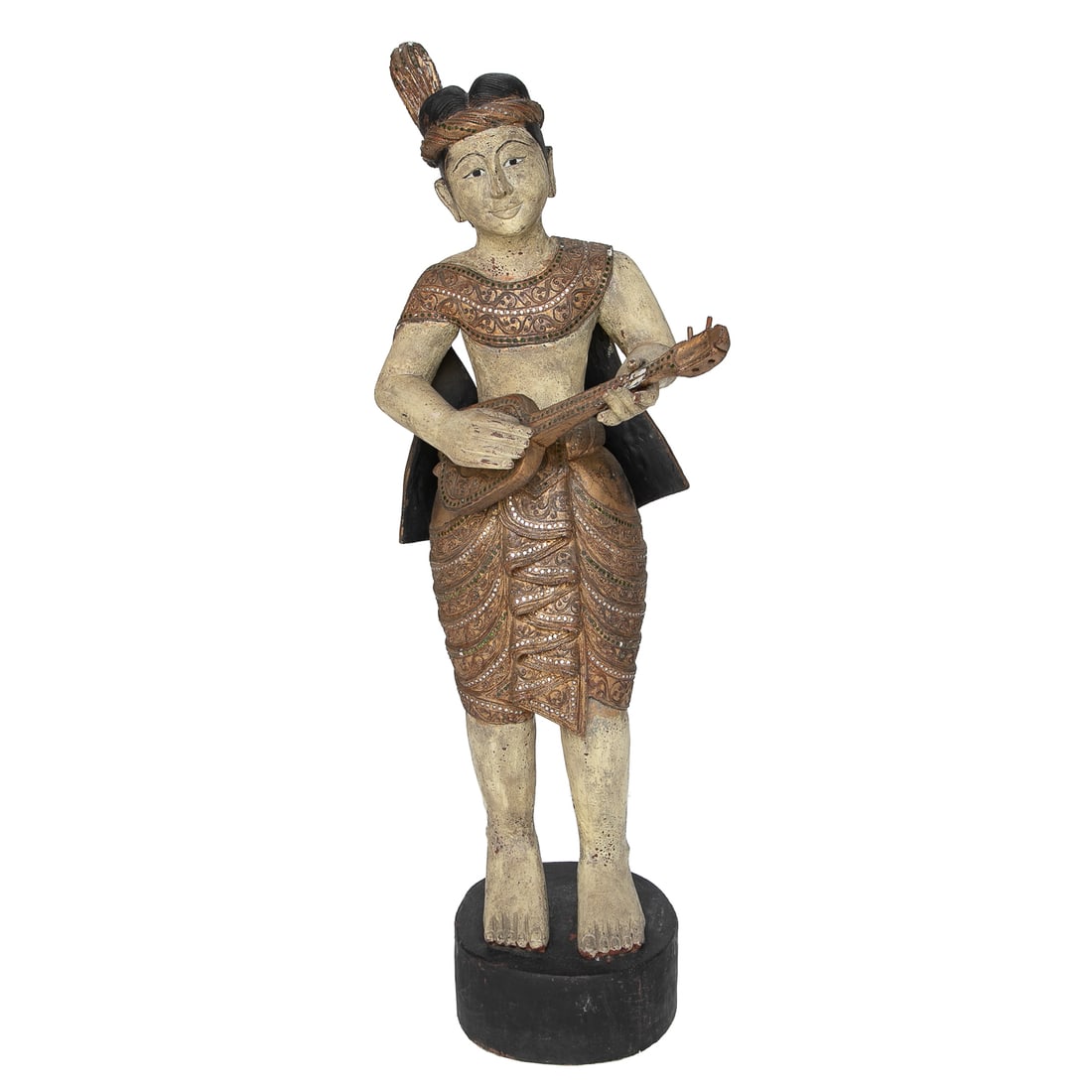 Mid Century Hand Carved and Painted Wood Male Thai Musician Statue: Mid Century Hand Carved and Painted Wood Male Thai Musician Statue, Having Head Band, Sash and Skirt All Featuring Jewels, Playing Guitar, Resting on Ebony Painted Circular Base. 43" High, 16" Wide, 1