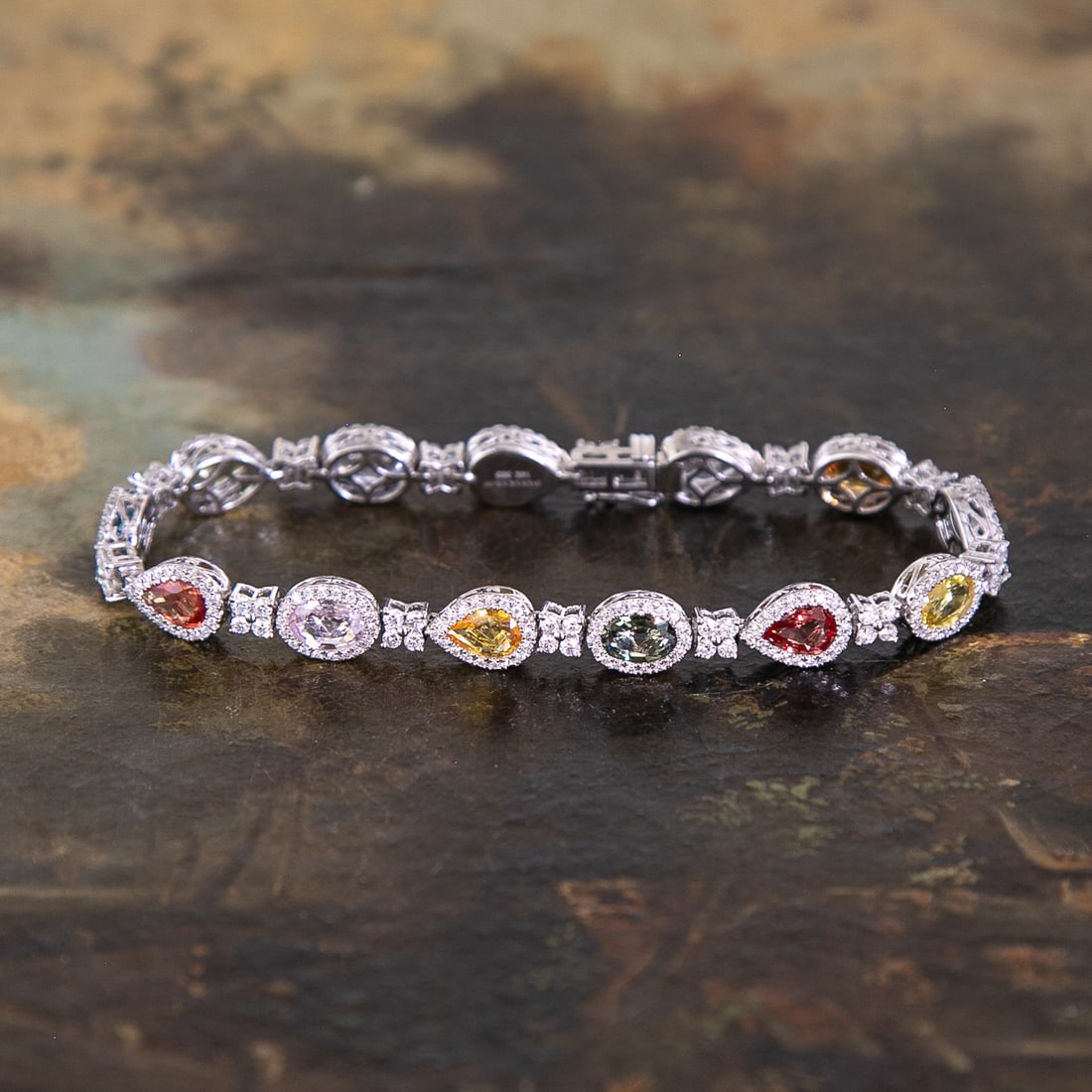 7.25 Inch 14K White Gold Multi Color Natural Sapphire and Diamond Bracelet: 7.25 Inch 14K White Gold Multi Color Natural Sapphire and Diamond Bracelet, Consisting of Thirteen (13) Multi Color Sapphires Weighing 6.50 Carats and 286 Natural Round Brilliant-Cut Diamonds