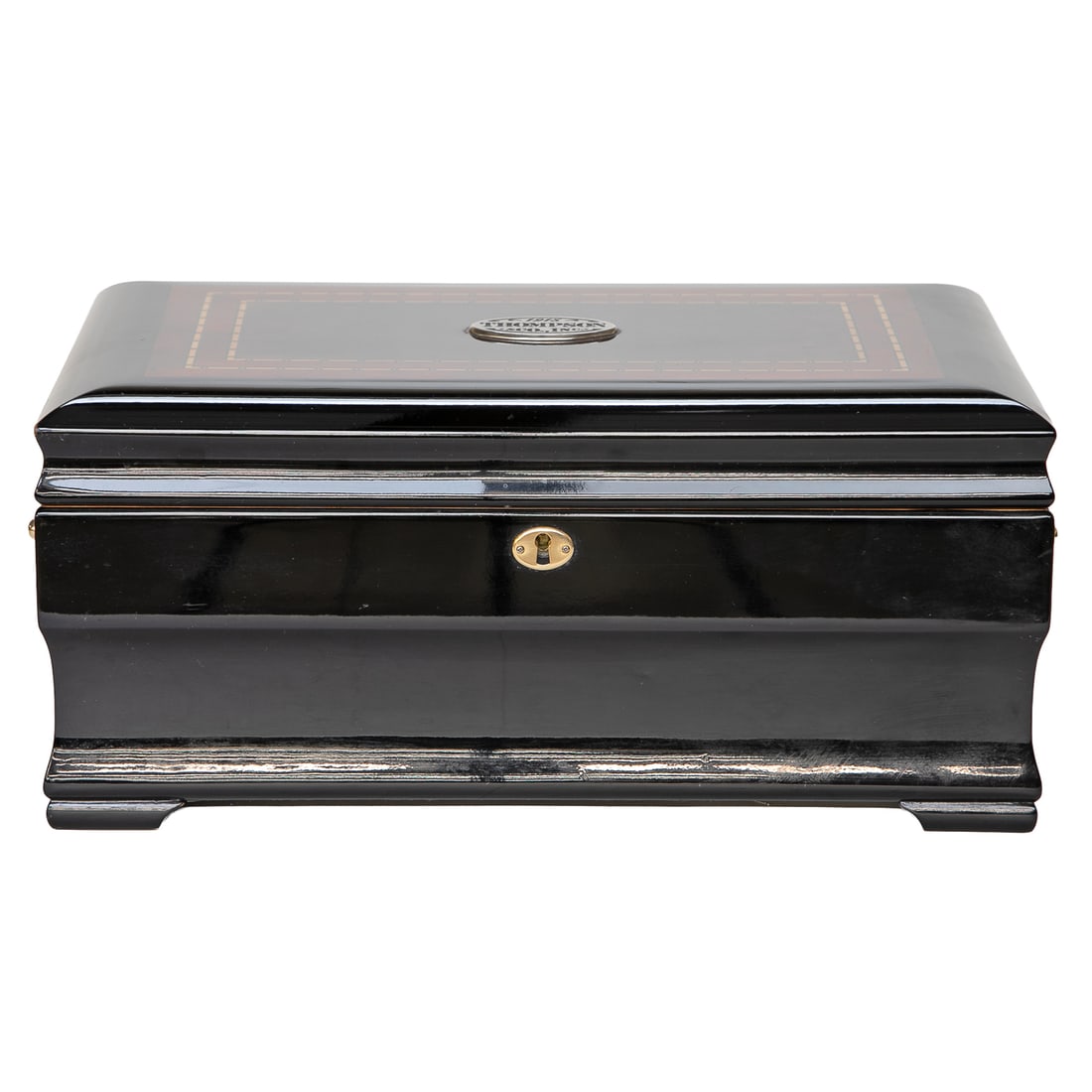 1915 Thompson and Co, Inc. Ebony Humidor: 1915 Thompson and Co, Inc. Ebony Humidor, Having Oval Plaque on Top, Inlaid Top Featuring Burl Walnut, Satinwood, Ebony and Mahogany, Brass Side Handles, Brass Escutcheon, Interior Reveals Storage