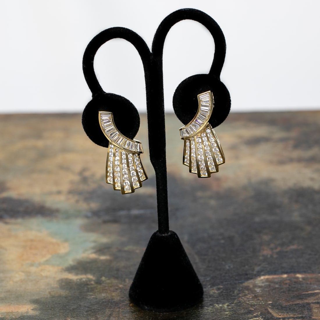18K Yellow Gold Diamond Earrings: 18K Yellow Gold Diamond Earrings, Consisting of One Hundred (100) Natural Round Brilliant-Cut and Tapered Baguette Diamonds Weighing 5.25 Carats. Diamonds are H in Color and VS in Clarity.