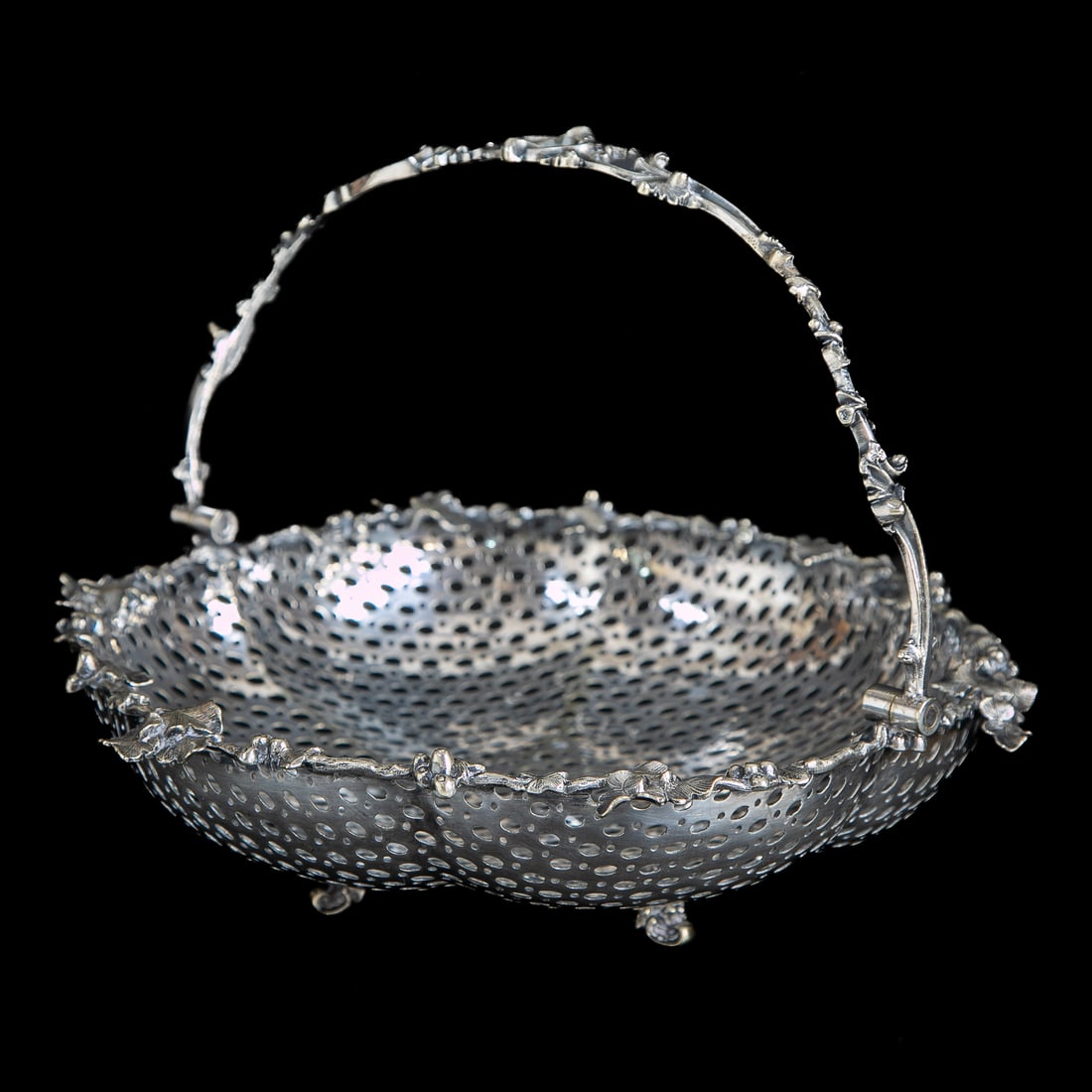 Vintage English Silver Plated Bread Basket: Vintage English Silver Plated Bread Basket, Having Pierced Basket Featuring Oval and Circular Designs, Handle Features Grape Vine Designs, Top Edge Features Grape Clusters, Leaves and Vines, Resting o