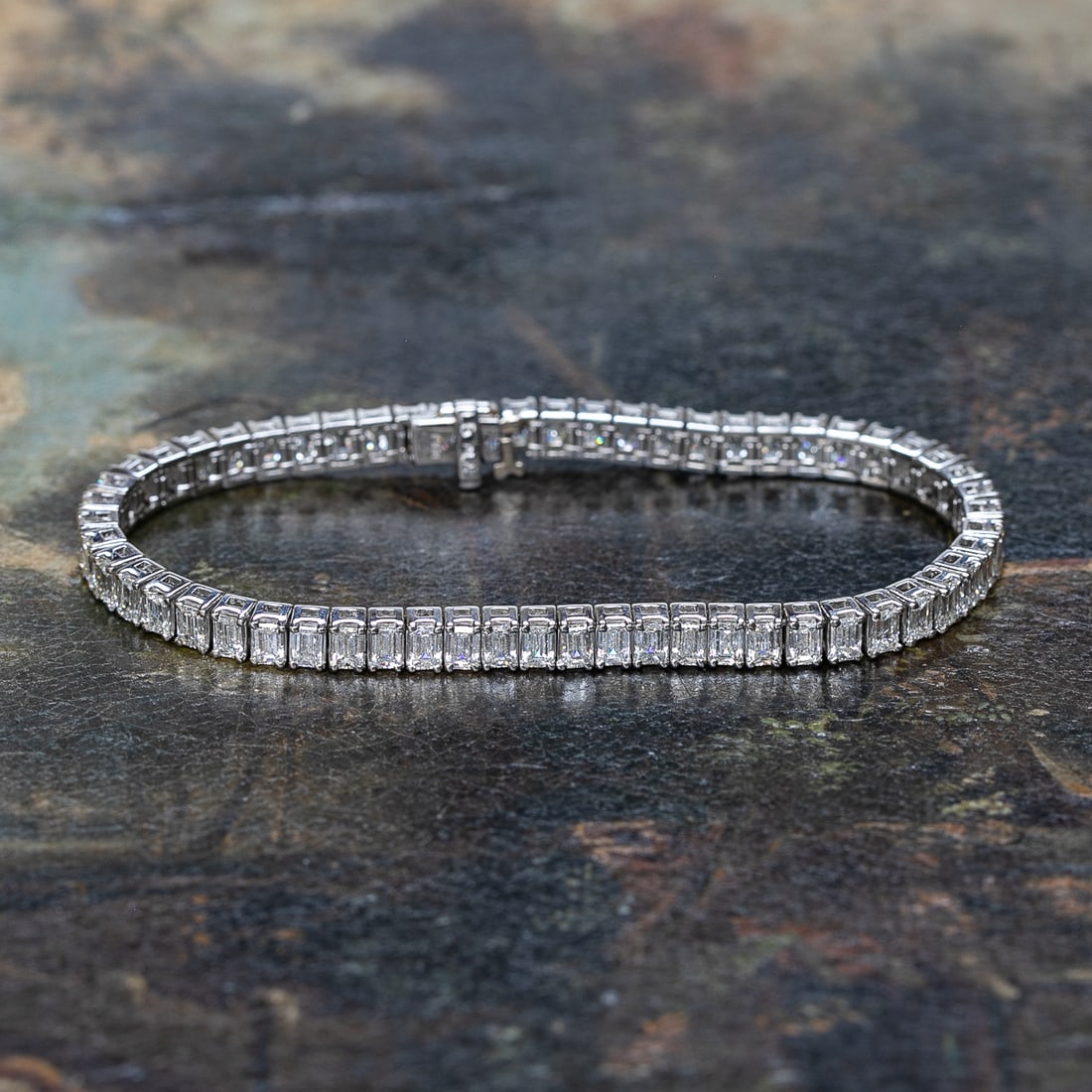 7.25 Inch Platinum Diamond Bracelet: 7.25 Inch Platinum Diamond Bracelet, Consisting of Fifty-Eight (58) Natural Emerald-Cut Diamonds Weighing 10.61 Carats. Diamonds are H in Color and VS in Clarity.