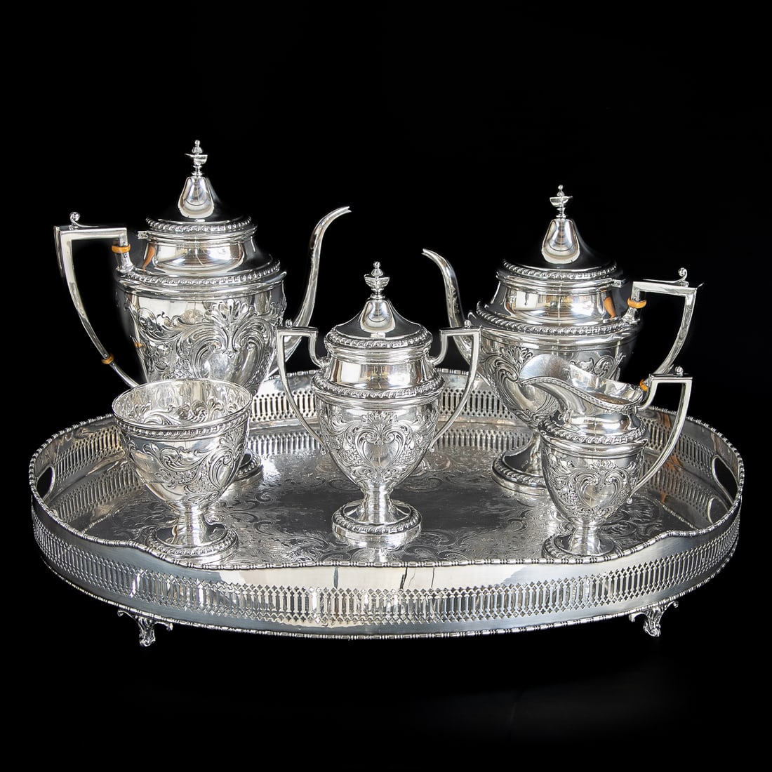 Hand Chased Sterling Silver Tea Service and Companion Tray, Six Total Pieces: Hand Chased Sterling Silver Tea Service and Companion Tray, Six Total Pieces, Includes One Oval Silver Plated Tray, EP on Copper, Having Pierced Reticulated Sides, Etched Serving Area Featuring Floral