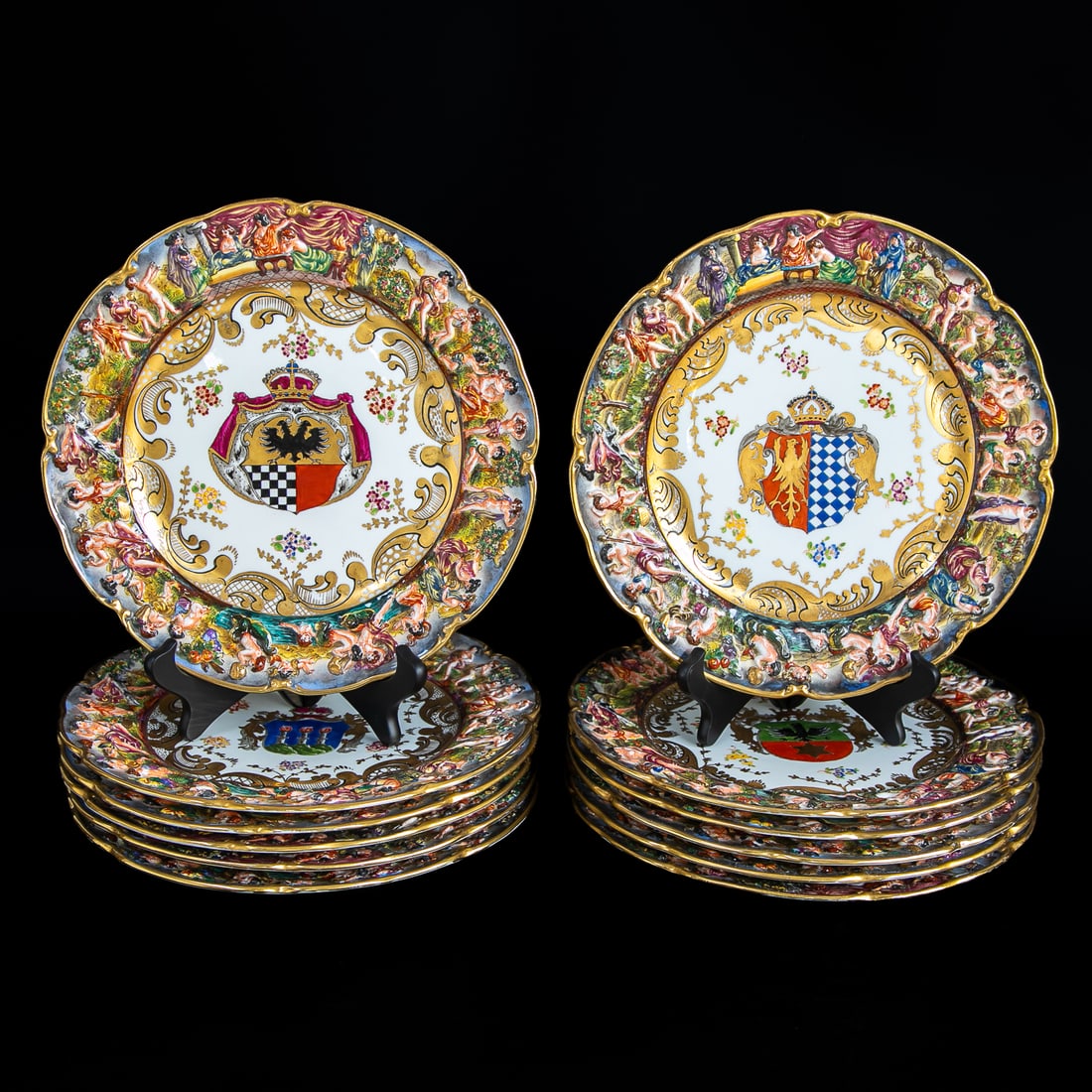 Capodimonte Porcelain Armorial Dinner Plates, Twelve Total: Capodimonte Porcelain Armorial Dinner Plates, Twelve Total, Having Crests in Center Surrounded by Gold Scroll and Floral Designs, Border Features Neoclassical Robed Figures Surrounded by Greenery, Gol