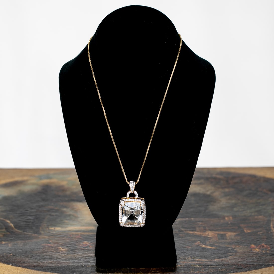 17 Inch 18K Yellow Gold Aquamarine and Diamond Pendant: 17 Inch 18K Yellow Gold Aquamarine and Diamond Pendant, Consisting of One Cushion-Cut Aquamarine Weighing 48.00 Carats and One Hundred Five (105) Natural Round Brilliant-Cut Diamonds Weighing 2.25 Car