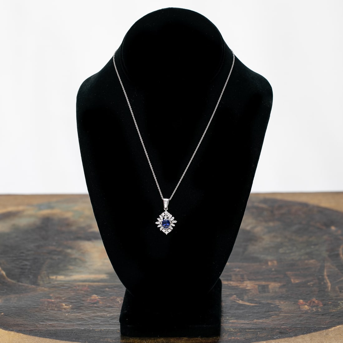 16 Inch 18K White Gold Blue Sapphire and Diamond Pendant: 16 Inch 18K White Gold Blue Sapphire and Diamond Pendant, Consisting of One Natural Oval Blue Sapphire Weighing 1.75 Carats and Thirty-Three (33) Natural Round and Baguette Diamonds Weighing 1.00 Cara