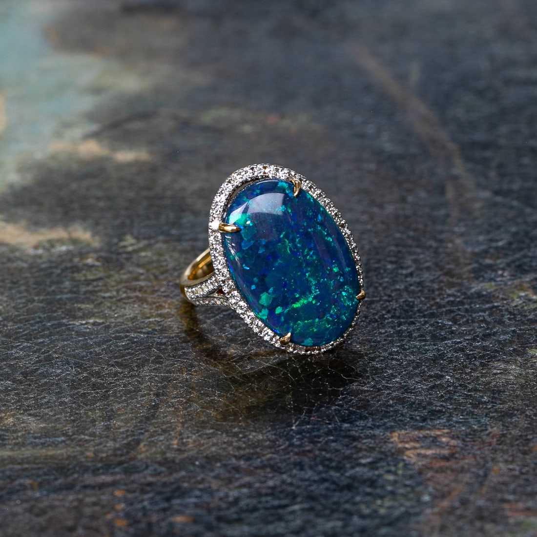 18K Yellow Gold Cabochon Black Opal and Round Diamond Ring, Size 6.75: 18K Yellow Gold Cabochon Black Opal and Round Diamond Ring, Size 6.75, Consisting of One Cabochon Black Opal Weighing 8.00 Carats and Seventy-Two (72) Natural Round Diamonds Weighing 1.00 Carat.
