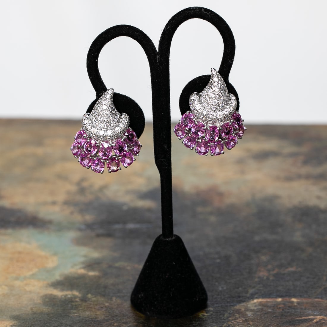 18K White Gold Pink Sapphire and Diamond Earrings: 18K White Gold Pink Sapphire and Diamond Earrings, Consisting of Twenty-Two (22) Oval Pink Sapphires Weighing 22.00 Carats and Fifty (50) Natural Round Brilliant-Cut Diamonds Weighing 3.25 Carats.