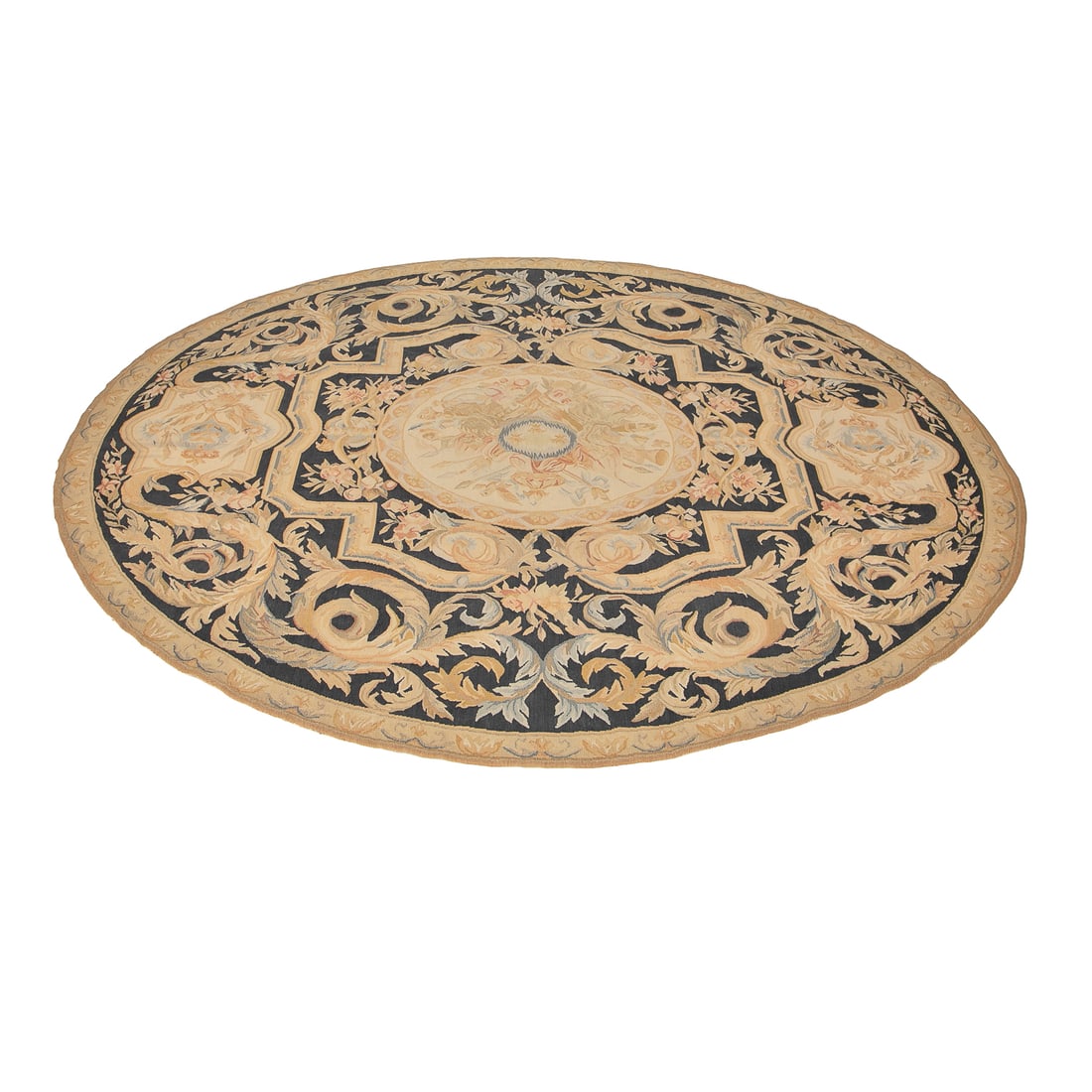 Vintage Circular Aubusson Rug: Vintage Circular Aubusson Rug, Having Ebony Ground, Center Features Shield Design With Pale Blue Fleur De Lis Surrounded by Tan Arrows and Floral Designs, Tan, Blue and Pale Pink Floral and Leaf