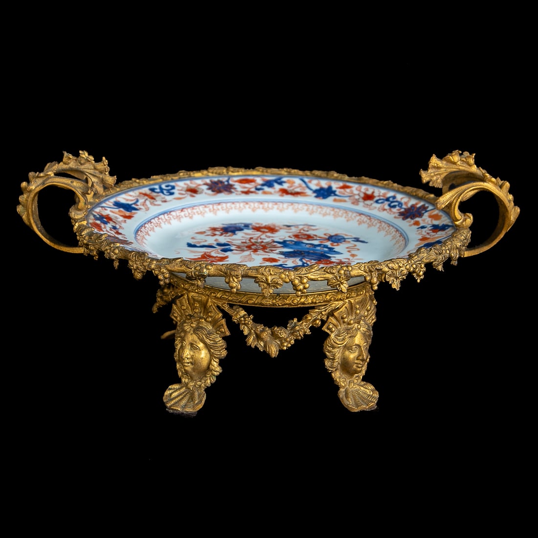 Late 19th C. Bronze Mounted Japanese Imari Plate: Late 19th C. Bronze Mounted Japanese Imari Plate, Plate Having White Ground, Floral Design Center, Floral and Leaf and Vine Design Border, In Cobalt Blue, Bittersweet and Tan Colors, Bronze Mount