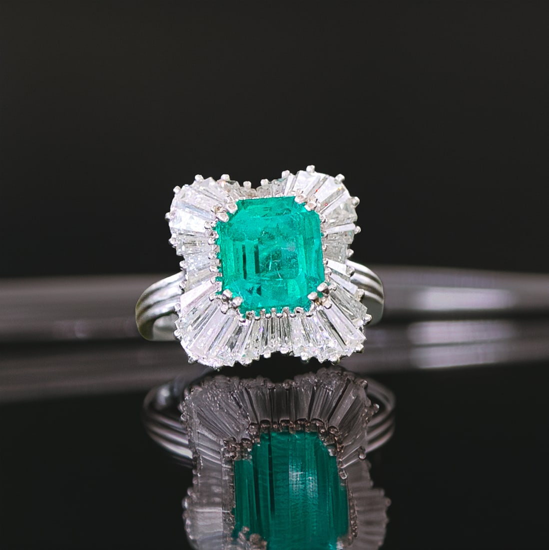 Platinum Emerald and Diamond Ring, Size 6.5: Platinum Emerald and Diamond Ring, Size 6.5, Consisting of One Natural Emerald-Cut Columbian Emerald Weighing 3.50 Carats and Twenty-Eight (28) Natural Tapered Baguette Diamonds Weighing 2.50 Carats.