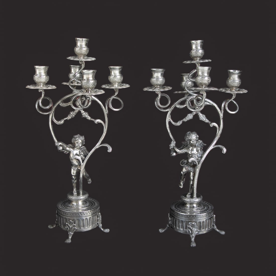 Late 19th C. English Sterling Silver Putti Five Branch Candelabra, Pair: Late 19th C. English Sterling Silver Putti Five Branch Candelabra, Pair, Having One Center Cup Surrounded by Four Additional Cups, All Having Double Facing Scrolls and Geometric Designs, Scroll Form A