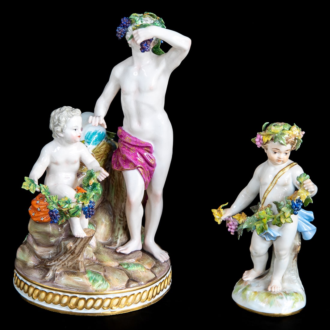 Late 19th C. Meissen Figures, Two Total: Late 19th C. Meissen Figures, Two Total, Includes One Figure of Putti Representing Autumn, Wearing Floral Head Band, Holding Grape Vine with Grape Clusters and Leaves, Standing on Ground Form Bottom, 