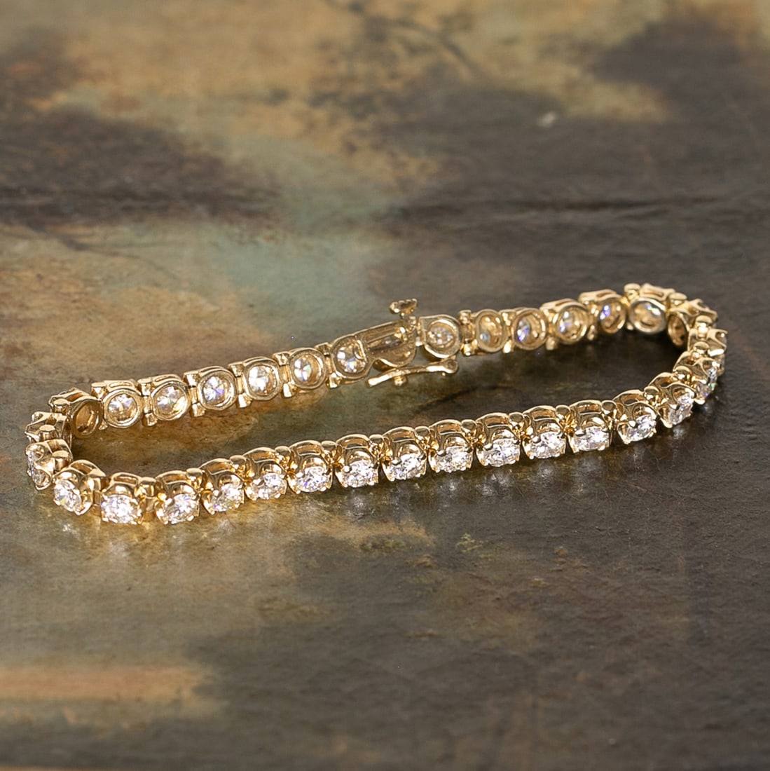 7 Inch 14K Yellow Gold Natural Diamond Bracelet: 7 Inch 14K Yellow Gold Natural Diamond Bracelet, Consisting of Thirty-Three (33) Natural Round Brilliant-Cut Diamonds Weighing 7.00 Carats. Diamonds are G in Color and VS in Clarity. Bracelet Weighs 1