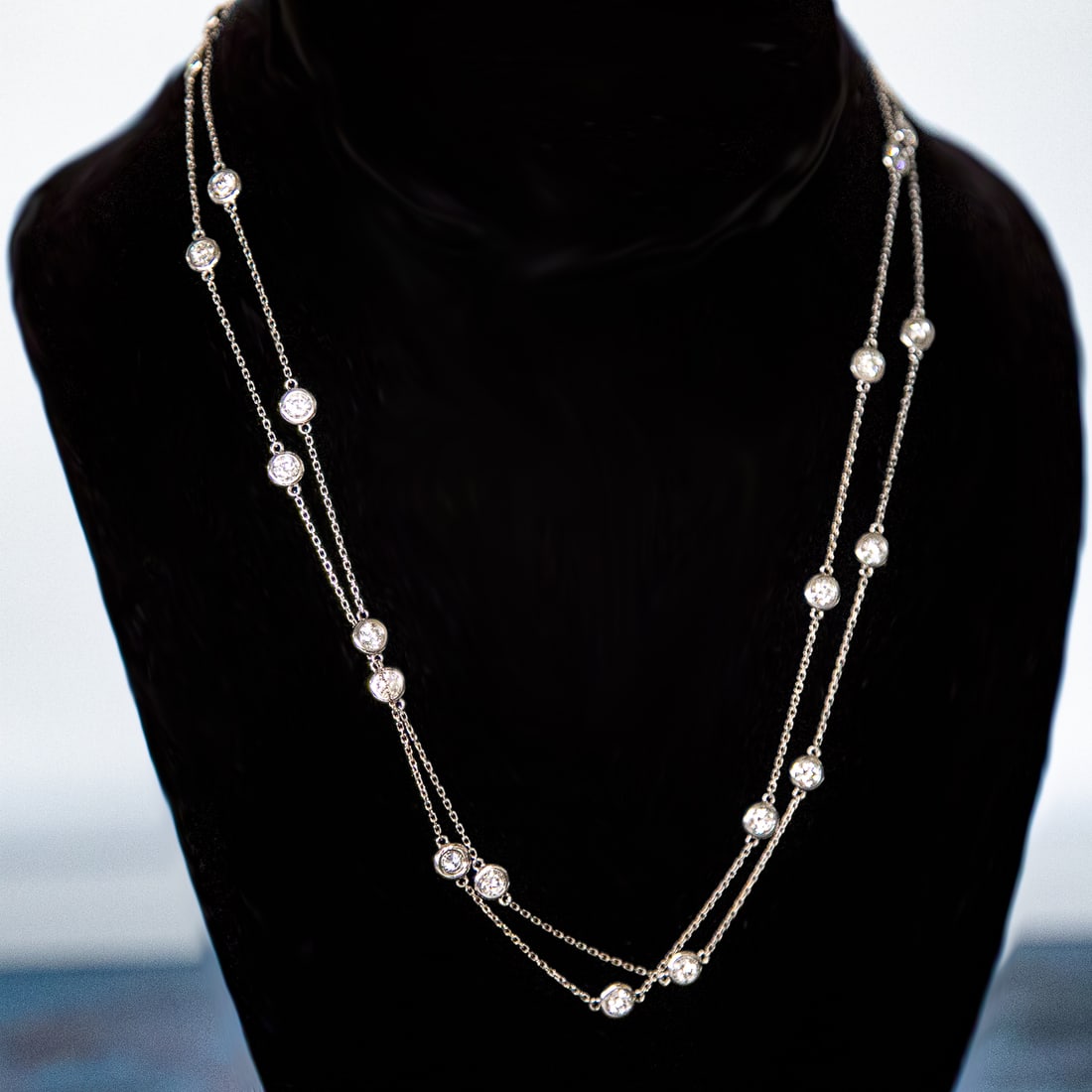36 Inch 14K White Gold Natural Diamond Station Necklace: 36 Inch 14K White Gold Natural Diamond Station Necklace, Consisting of Twenty-Four (24) Natural Round Brilliant-Cut Diamonds Weighing a Total of 4.66 Carats. Diamonds are H in Color and VS in Clarity.