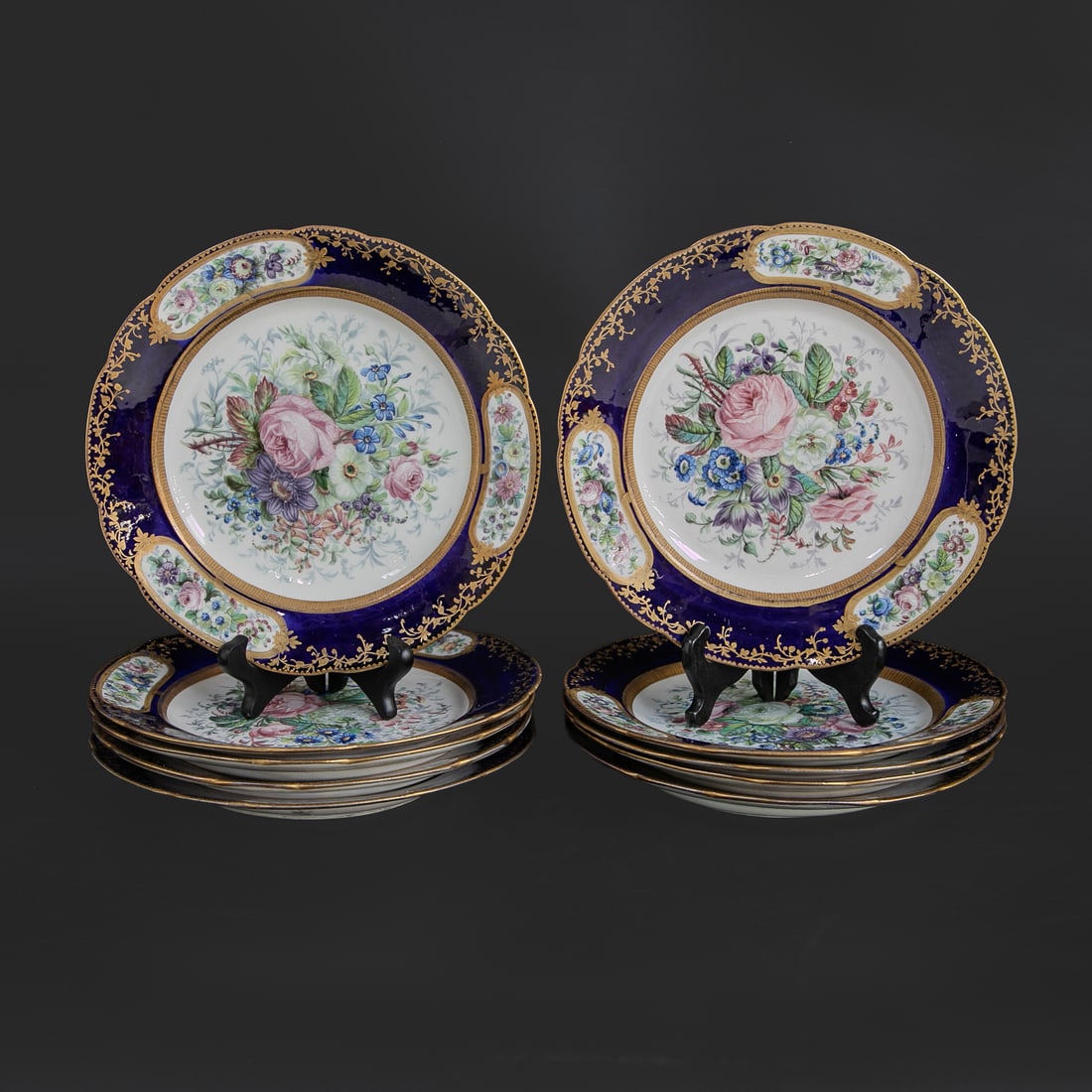 Late 19th C. Sevres Cobalt Blue Hand Painted Floral Dinner Plates, Ten Total: Late 19th C. Sevres Cobalt Blue Hand Painted Floral Dinner Plates, Ten Total, Having Cobalt Blue Border Featuring Gold Floral and Leaf Designs Along with Oval Multi Color Hand Painted Panels, Centers