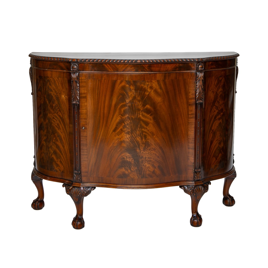 Late 19th C. English Mahogany Chippendale Style Shaped Top Cabinet: Late 19th C. English Mahogany Chippendale Style Shaped Top Cabinet, Having Shaped Cross Banded Top, Rope Carved Edge, Flame Mahogany Front and Sides Featuring Carved Acanthus Leaf Designs, Atop Line a