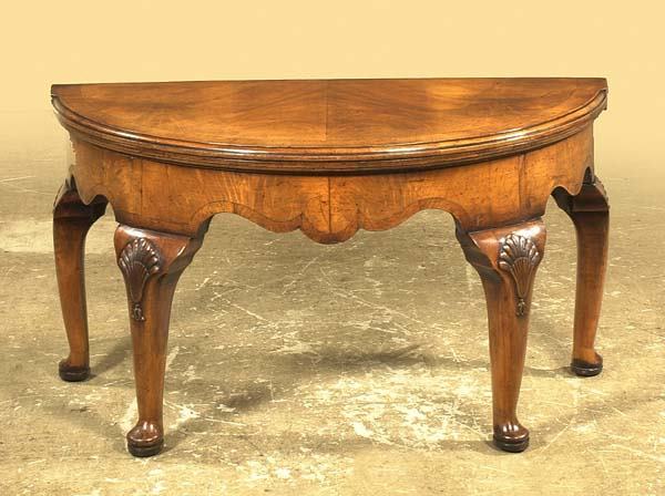 Queen Anne walnut demilune lift top tea table on: Queen Anne walnut demilune lift top tea table on cabriole legs with shell carved knees and pad feet, c.1890, 36" wide, 18" deep, 20" high