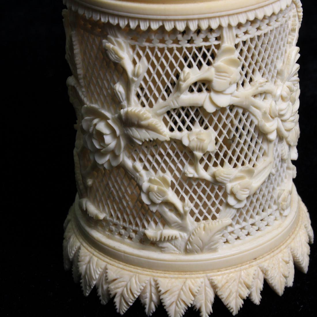 Chinese Bone Carved & Pierced Box: Estimate: $50-$60 Description: Antique Chinese bone carved & pierced box. Exquisite floral carvings. Dimensions: Appx 3.25" high Condition: