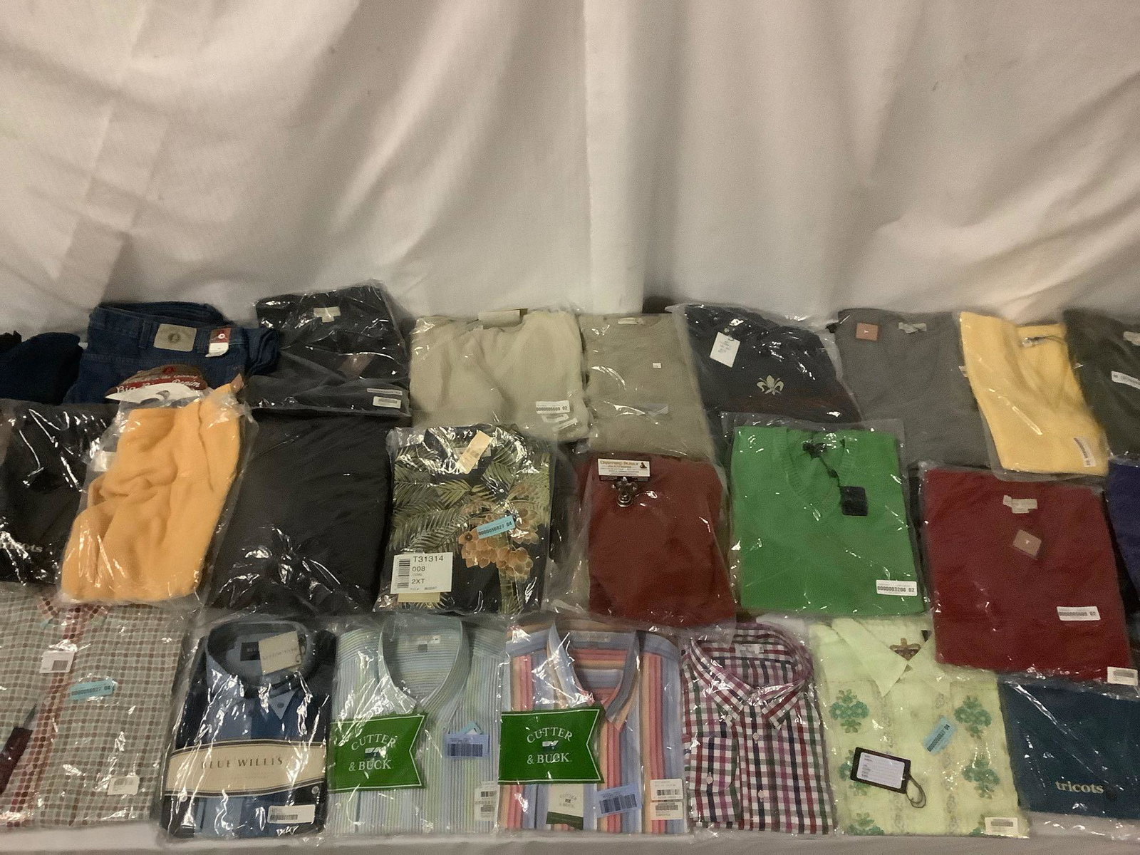 Collection of over 30 new in package Menâ€™s 2XL size: Collection of over 30 new in package Menâ€™s 2XL size clothing; sweaters, dress shirts and more. Tommy Bahama, Cutter and Buck, Blue Williâ€™s, Tricots St. Raphael, Robert Graham, Bobby Jone