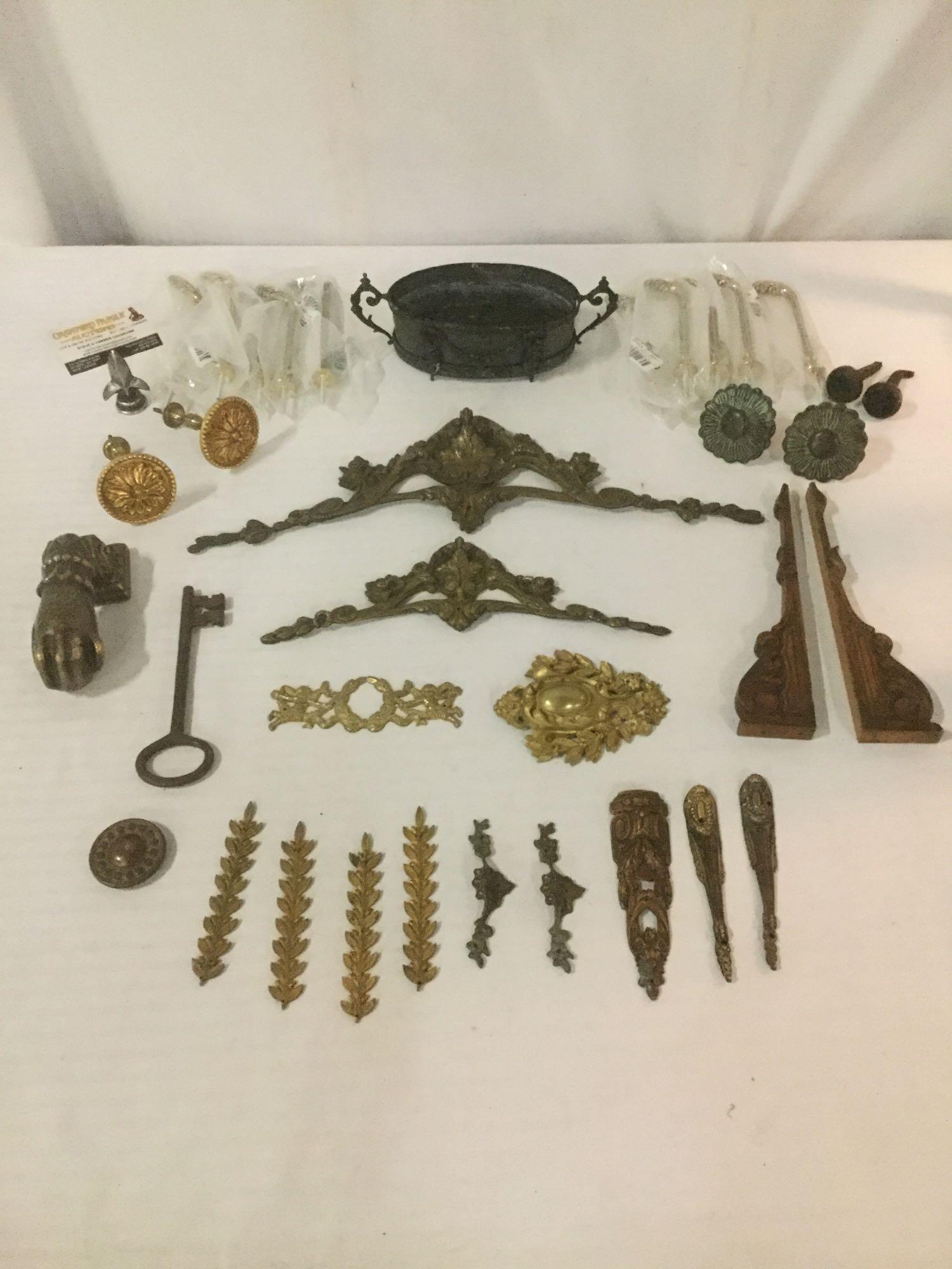 35 pieces of mostly metal regal decor, incl. floral: 35 pieces of mostly metal regal decor, incl. floral trim pieces, a hand door knocker, a master key, and more! Largest piece approx. 10x5x3 inches.