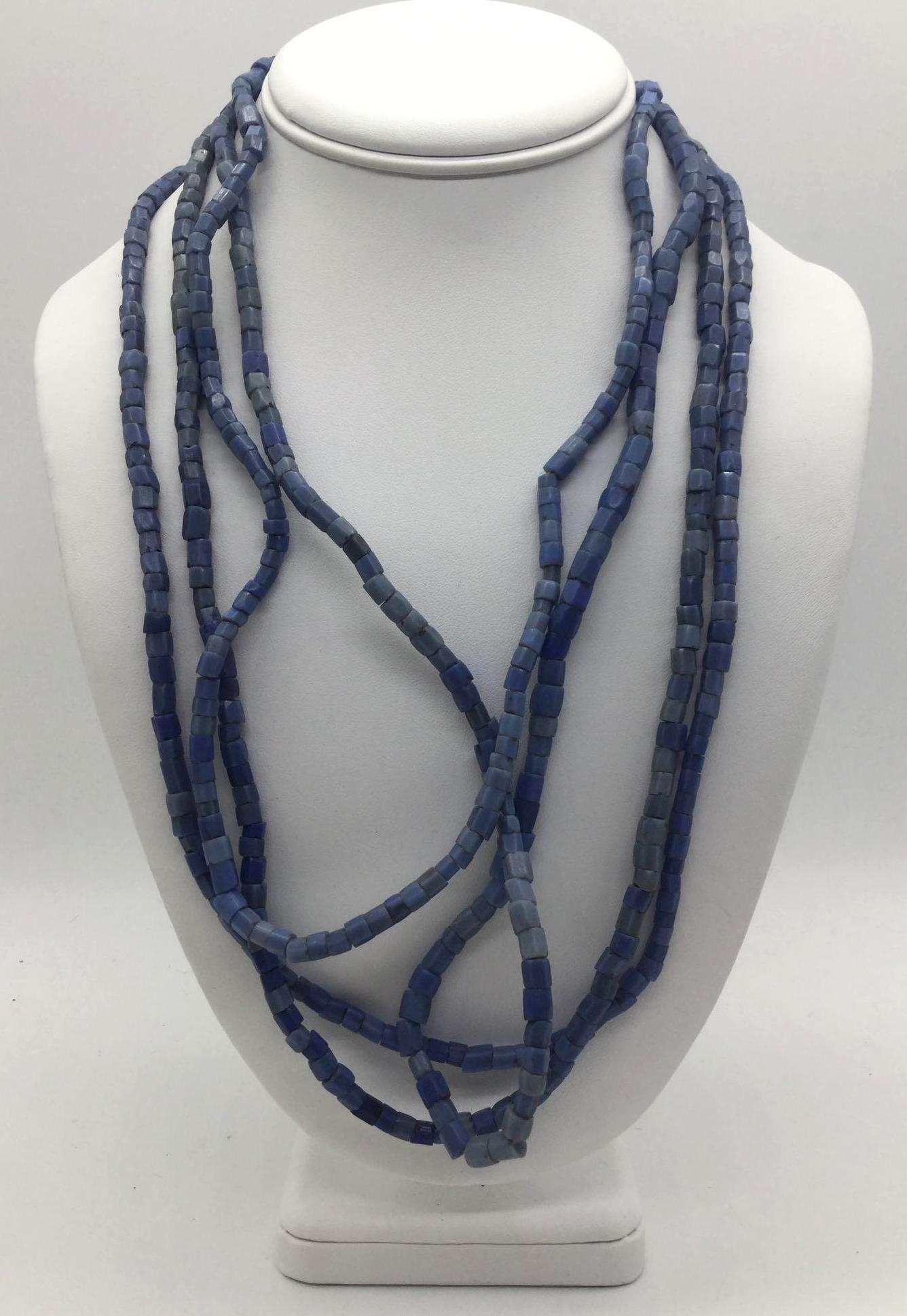 Collection of four strands of antique Czech blue glass: Collection of four strands of antique Czech blue glass African trade beads. Longest approx 24 inches.