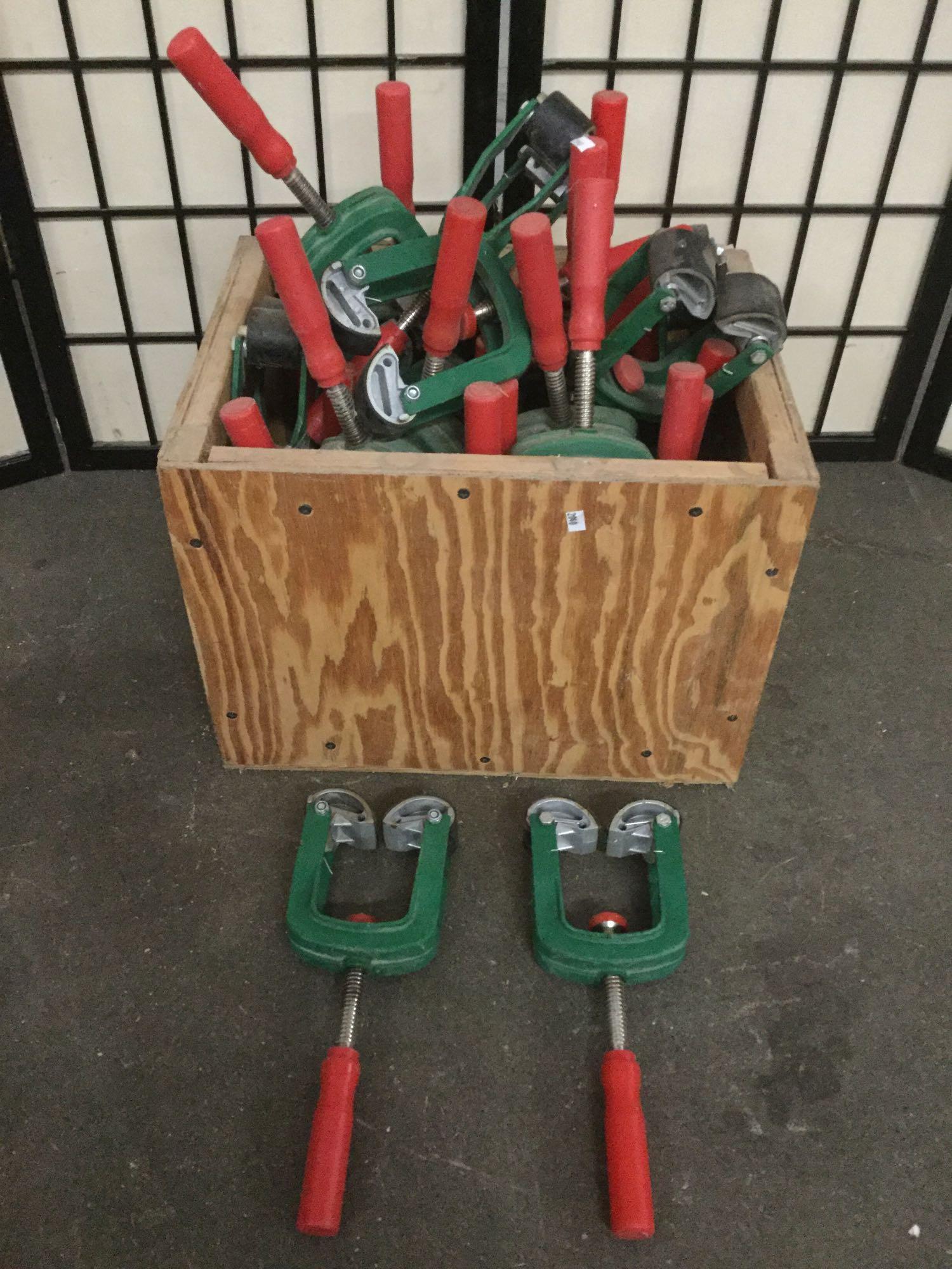 Wood crate full of approx. 30 unbranded pipe clamps, (1 of 4)