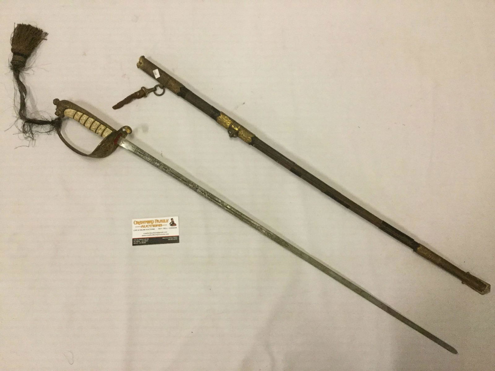 Antique sword and scabbard with fold-over lock guard. (1 of 10)