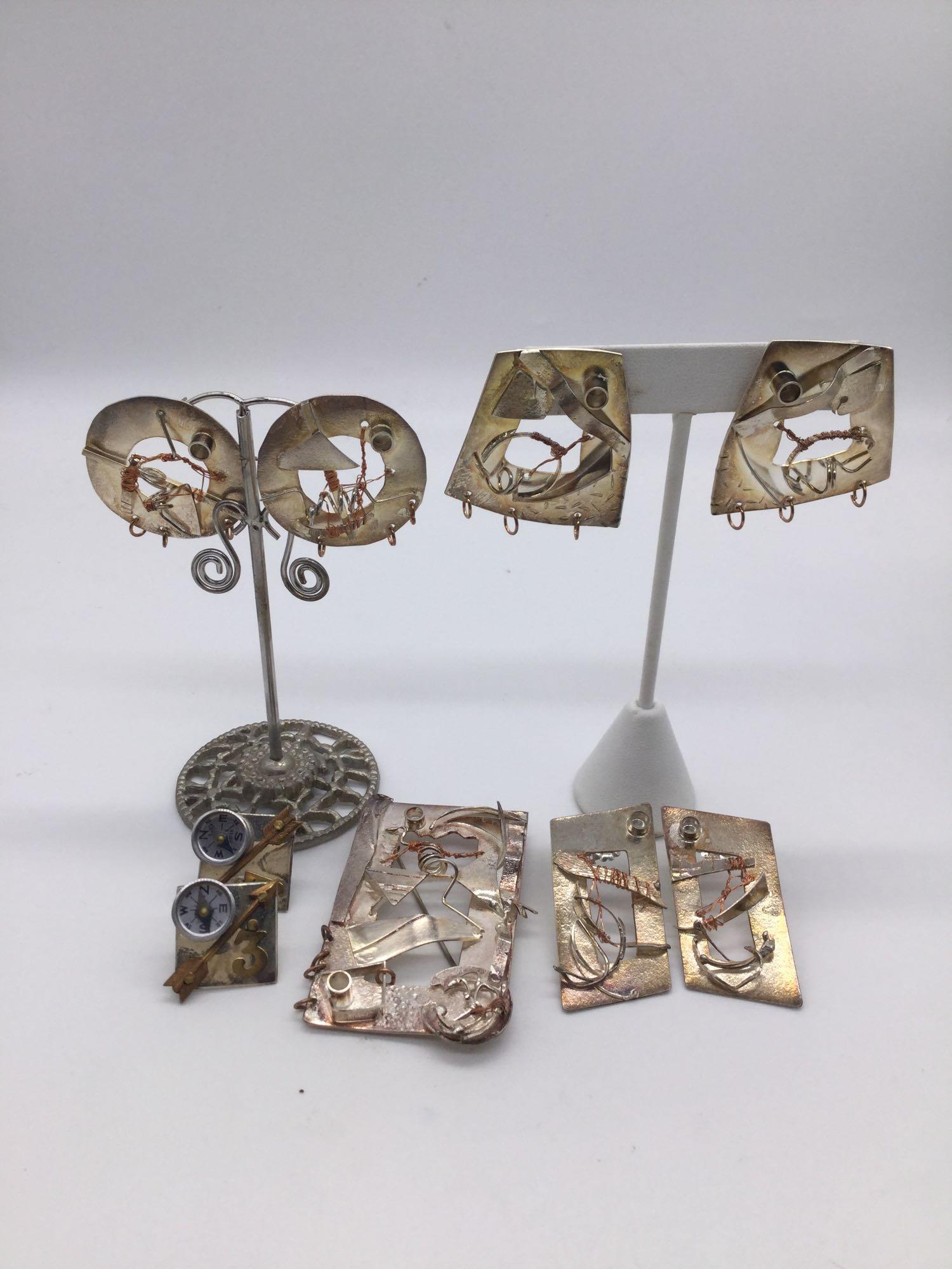 4 pairs of art jewelry earrings, 1 brooch. 1 pair: 4 pairs of art jewelry earrings, 1 brooch. 1 pair signed by Jill Henry, and rest by different artist, signed in brooch. Brooch approx 2.5x1.5x0.5 inches.