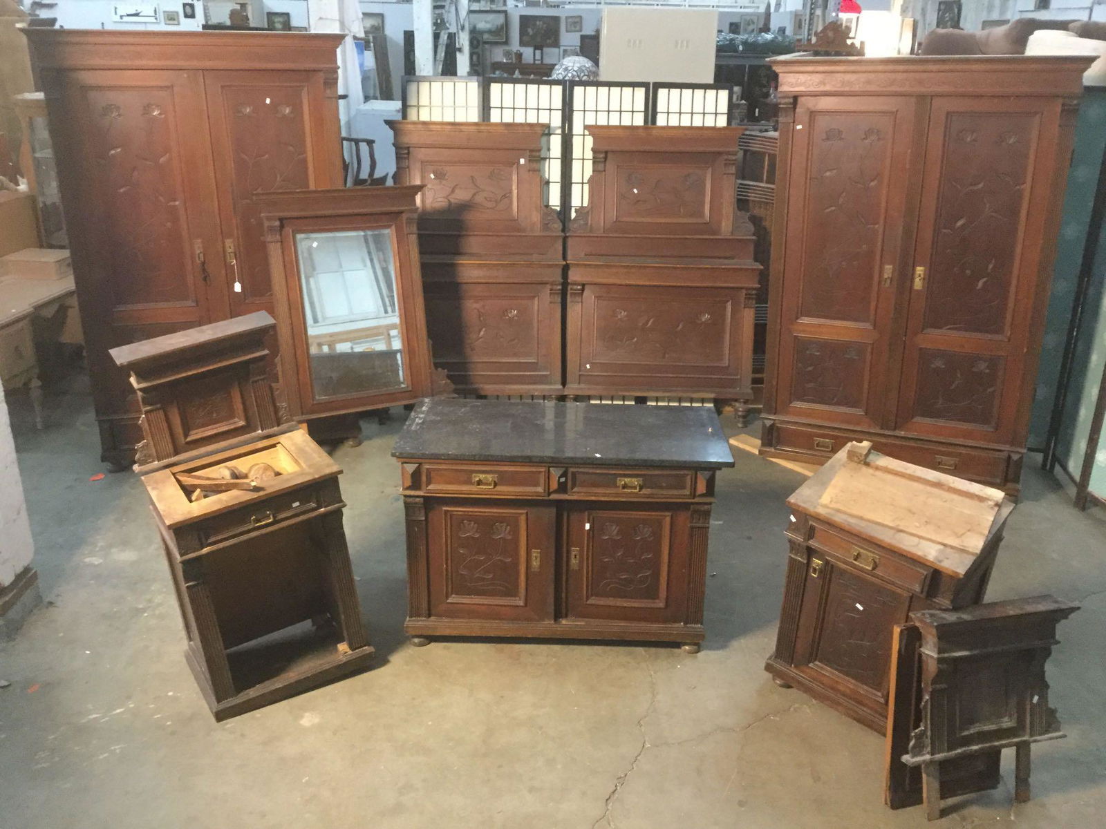 Antique early 20th century bedroom set w/2 armoires, 2: Antique early 20th century bedroom set w/ 2 large armoires, 2 twin bed frames (w/o rails), 2 side tables (unattached pieces), & a marble top dresser w/ (unattached) mirror, all with hand carved fl
