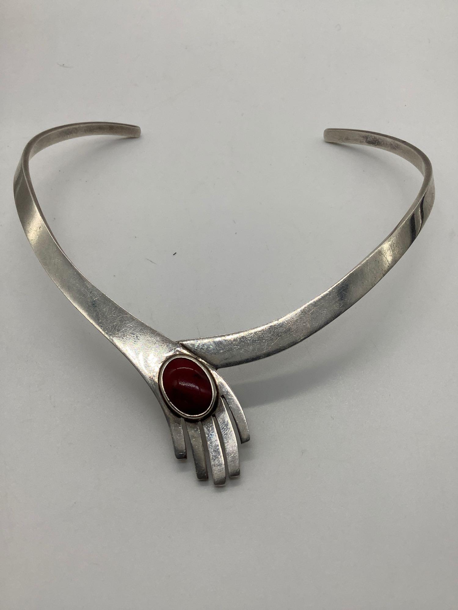 Mexican sterling silver choker necklace featuring red: Mexican sterling silver choker necklace featuring red stone. Weighs 56.9g. Approx 13 inches.