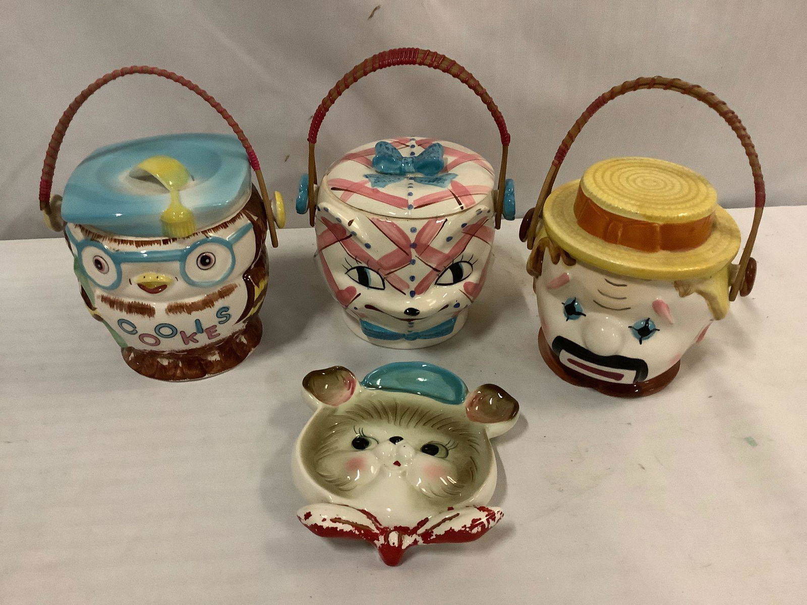 3 vintage handpainted character cookie jars/biscuit: 3 vintage handpainted character cookie jars: cat, owl, clown, and Grantcrest (Japan) bear face plate. Largest approx 6.5x6.5x6.5 inches.