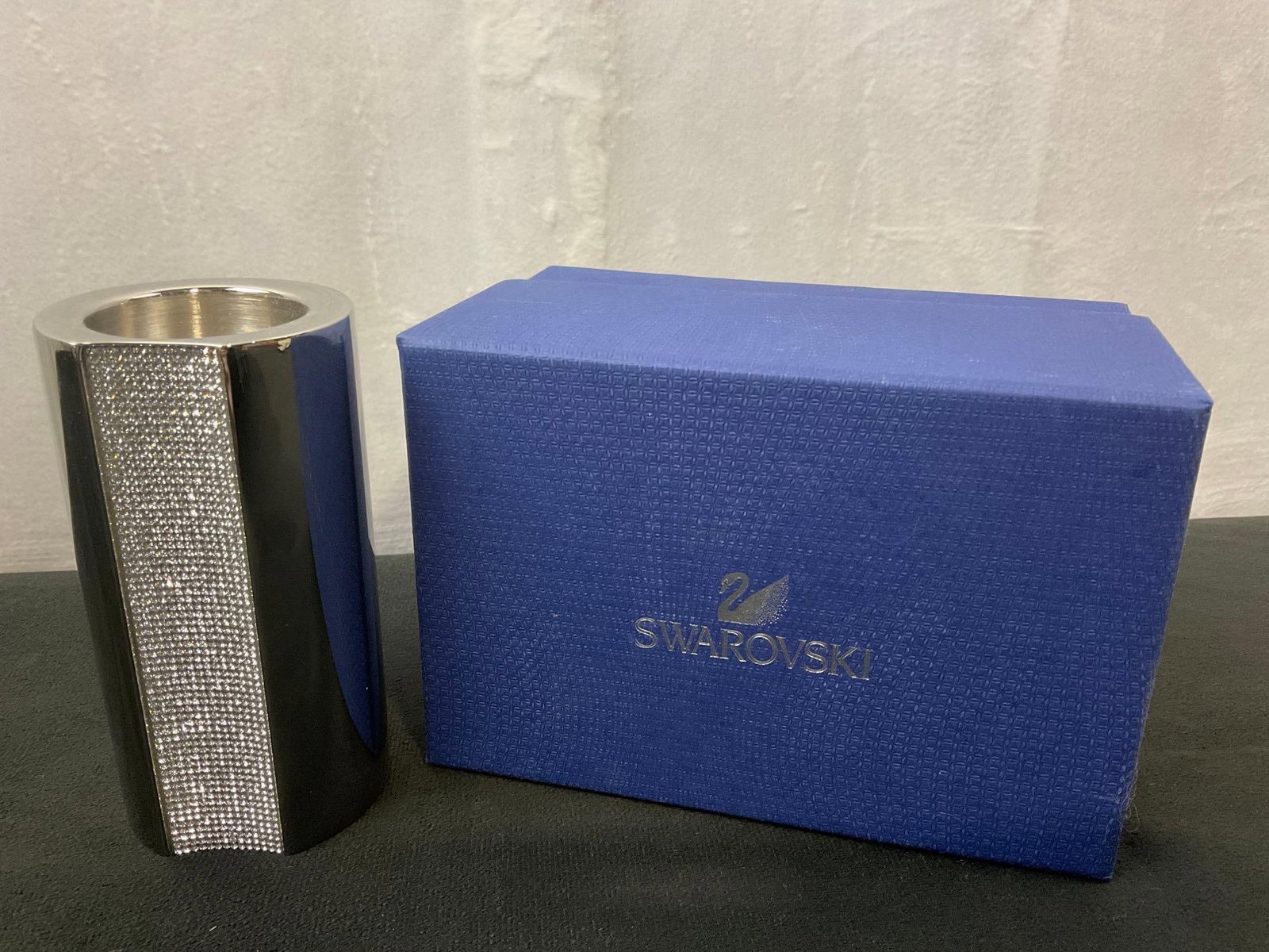 Modern SWAROVSKI AMBIRAY TEA LIGHT HOLDER: Modern SWAROVSKI AMBIRAY TEA LIGHT HOLDER ORIGIN: Austria. MATERIALS: faceted crystals, surrounded by unnamed metal case. DIMENSIONS: 4.5 tall DESCRIPTION: Embellished with faceted