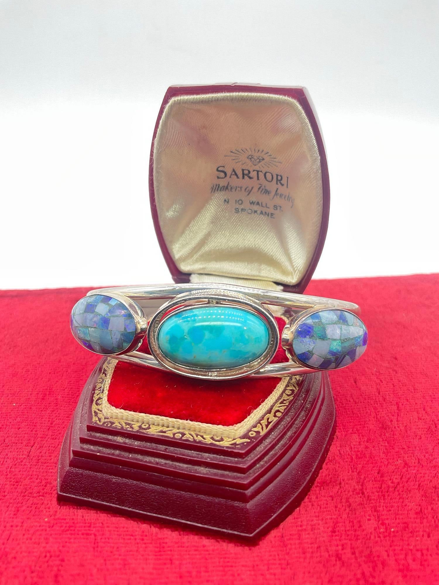 Sterling silver cuff bracelet with tri-stone setting - mosaic opal/shell and turquoise cabochon: Center stone is on a rotating base so it can be flipped to opal/shell or turquoiseJC-2619