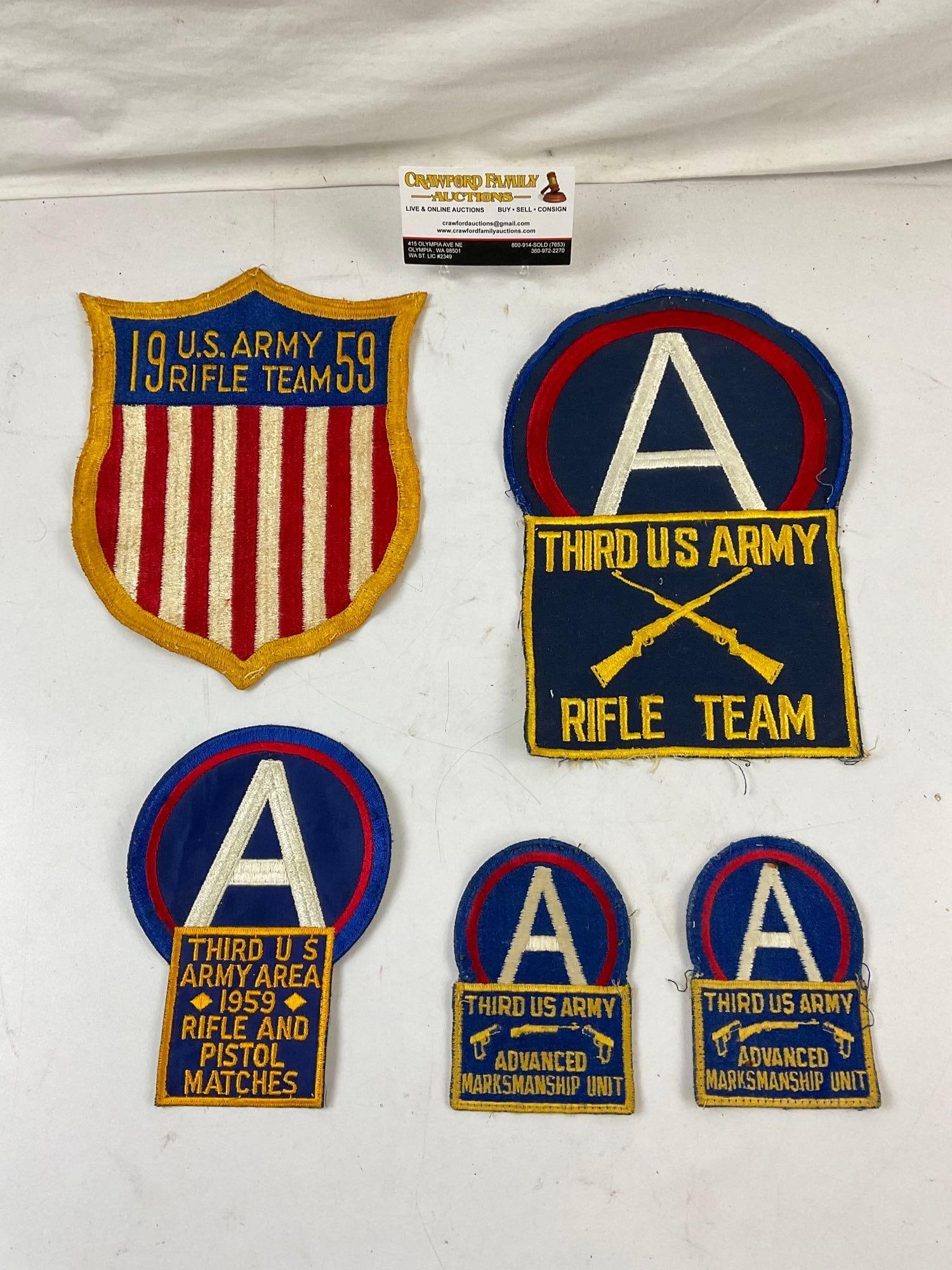 5 Assorted Vintage 1959 U.S. Army Military Patches. Third US Army Rifle Team. See pics: 5 Assorted Vintage 1959 U.S. Army Military Marksmanship Patches. Third US Army Rifle Team 1959. Rifle and Pistol Matches 1959, Advanced Marksmanship Unit. Measures 10" x 7" See pics. E-414
