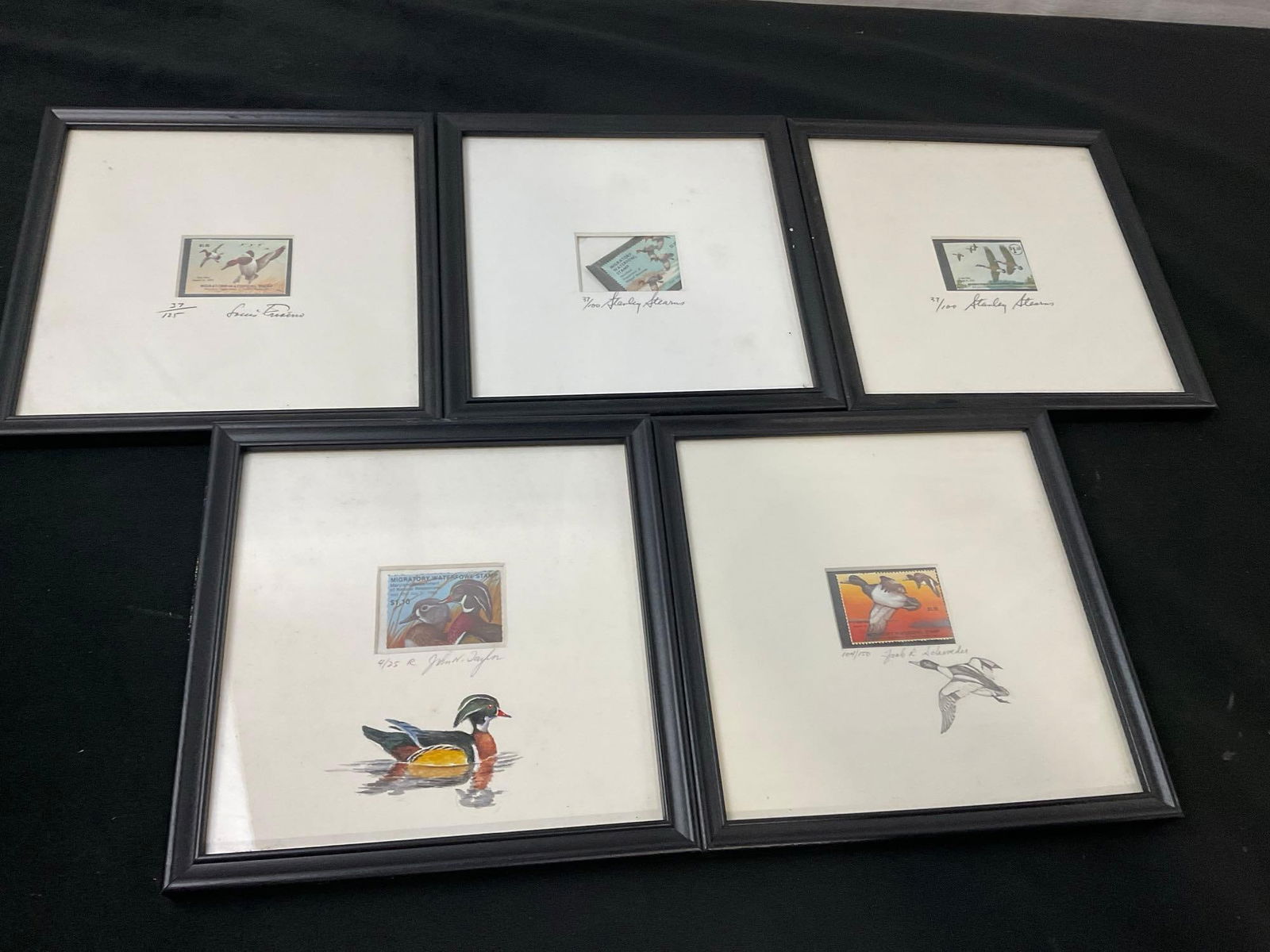 5 Framed Duck Stamps, Signed & #d by 4 different well renowned artists, 2x w/ Remarque by artist: Duck stamps signed by incl. Stanley Stearns, John Taylor, Louis Frisino, Jack Schroeder Respectively 37/125, 37/100, 37/100, 4/25, 104/150. Appears to be in good shape. Measures appro