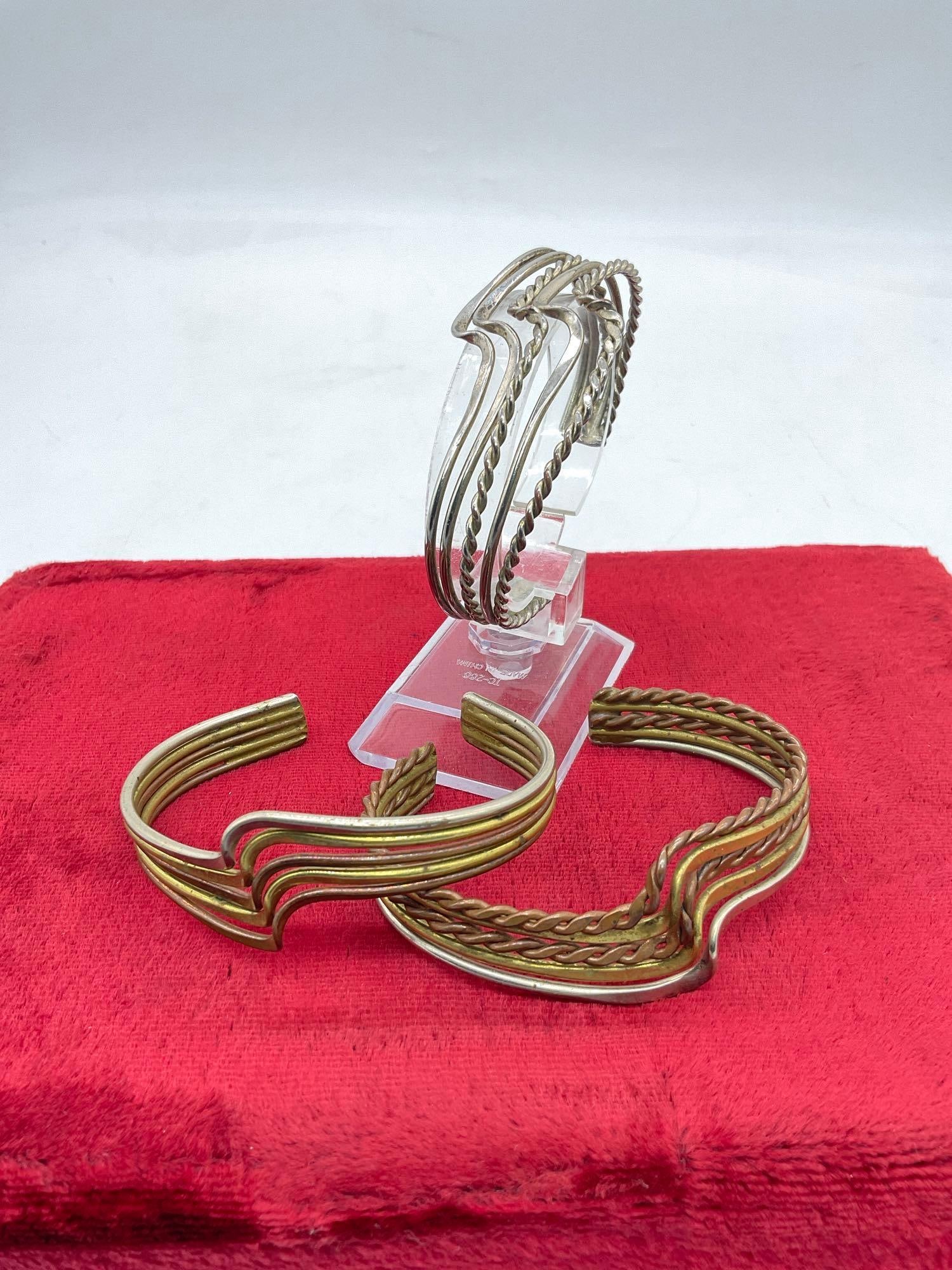 3 pairs of lovely .925 sterling silver cuff bracelets incl. tri-tone and braided designs - 65 grams:  