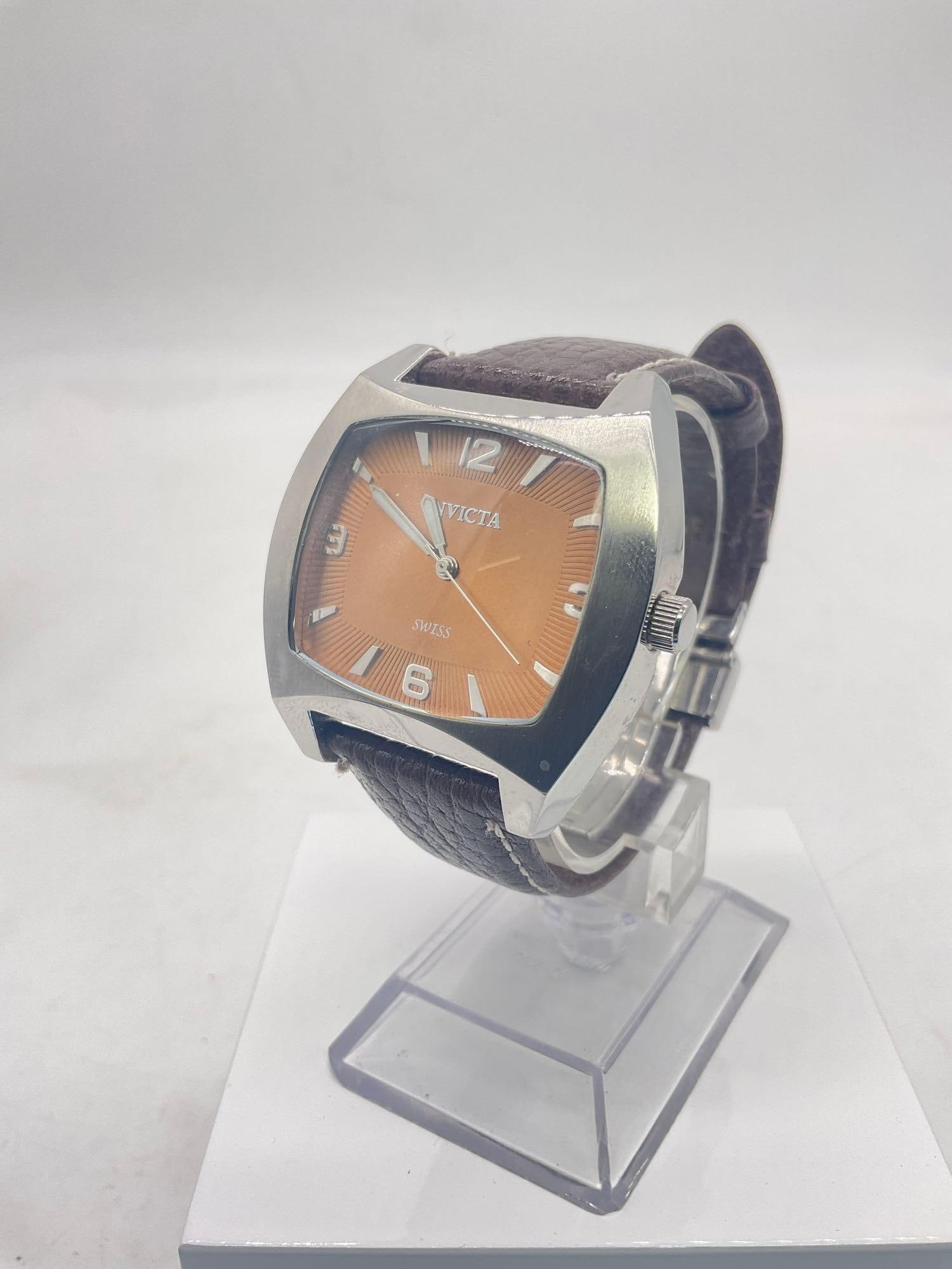 Invicta swiss 2239 mens stainless wristwatch with brown leather band and pale gold face: All watches need batteries unless otherwise noted or it is a swiss movement watch in which case it will need servicing unless otherwise noted. See pics, JC-2646