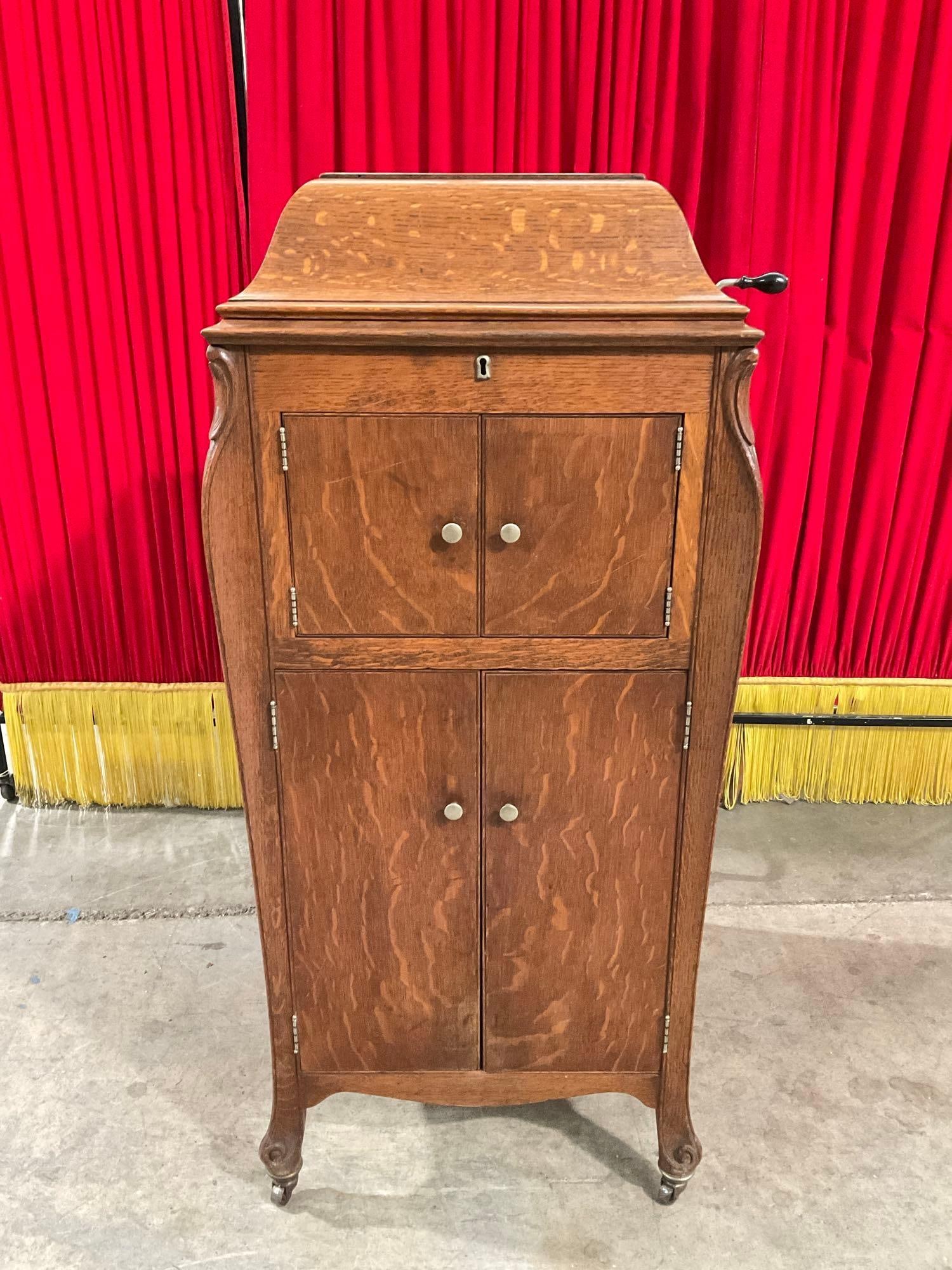 Antique Victor Victrola Gramophone Record Player in Tiger Oak Cabinet w/ Approx. 40+ Records. See: Antique Victor Victrola Crank Gramophone Record Player in Wheeled Tiger Oak Cabinet w/ Approx. 40+ Unresearched Records. Recently repaired in 2012, untested but should play. Condition is fair to good.