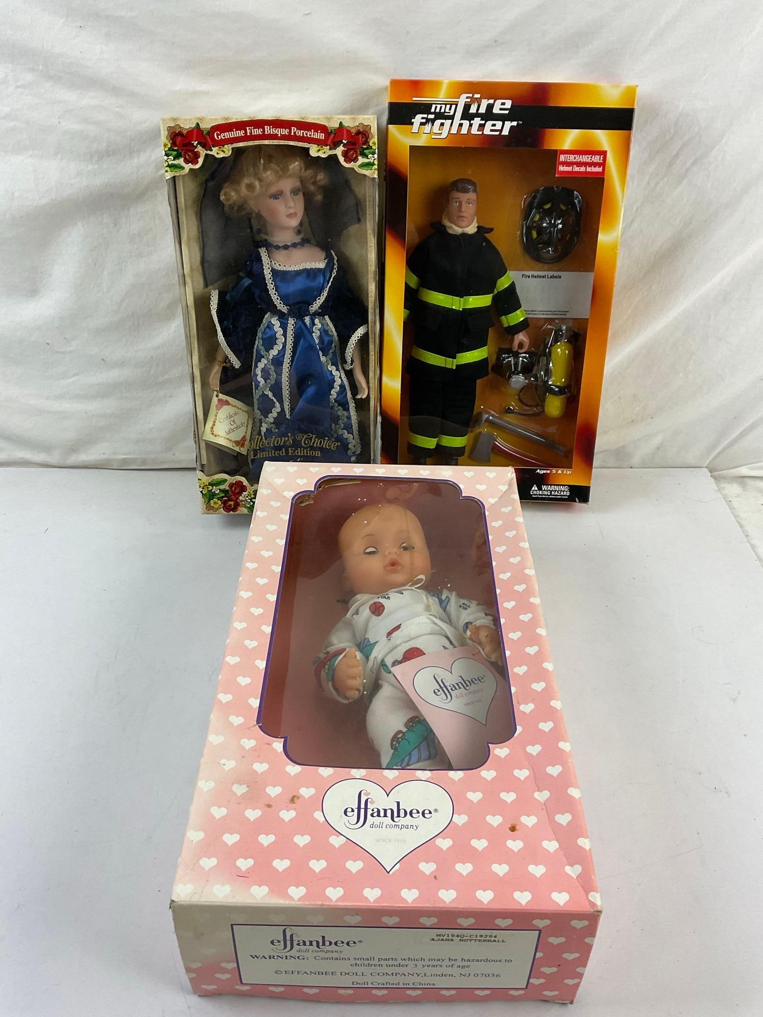 Collection of 3 Vintage Dolls incl. My Fire Fighter, Collectors Choice Fine Porcelain, & Effanbee: Ajama Butterball. All new in box. See pics. T-2623
