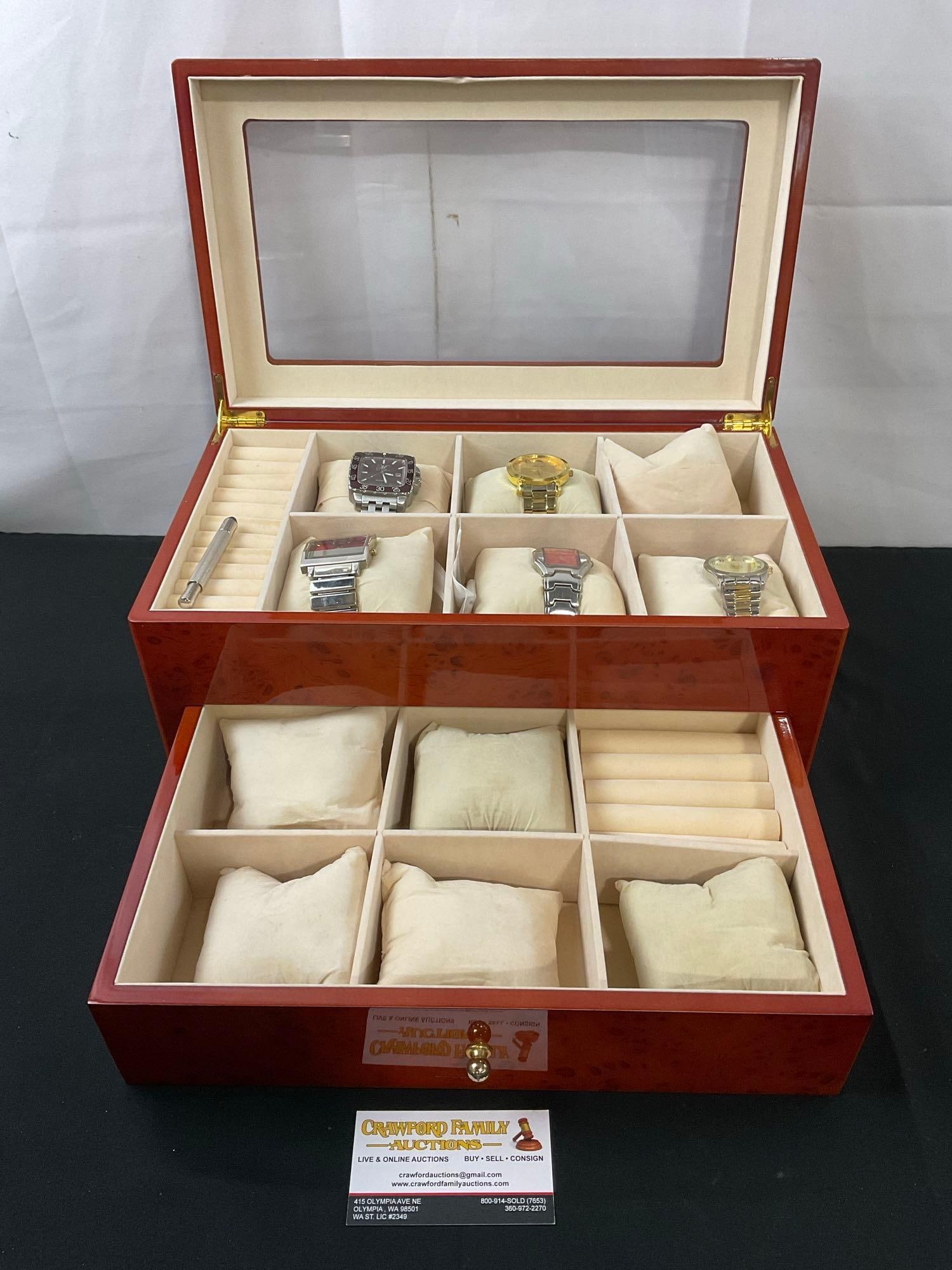 5 Fashion Watches in 12 slot Watch and Ring Box, Burl Wood pattern w/ drawer & glass window on top: Matches lot 61. Appears to be in good shape. The case measures about 6.75h x 15w x 8.5d inches. See pics. E-2646