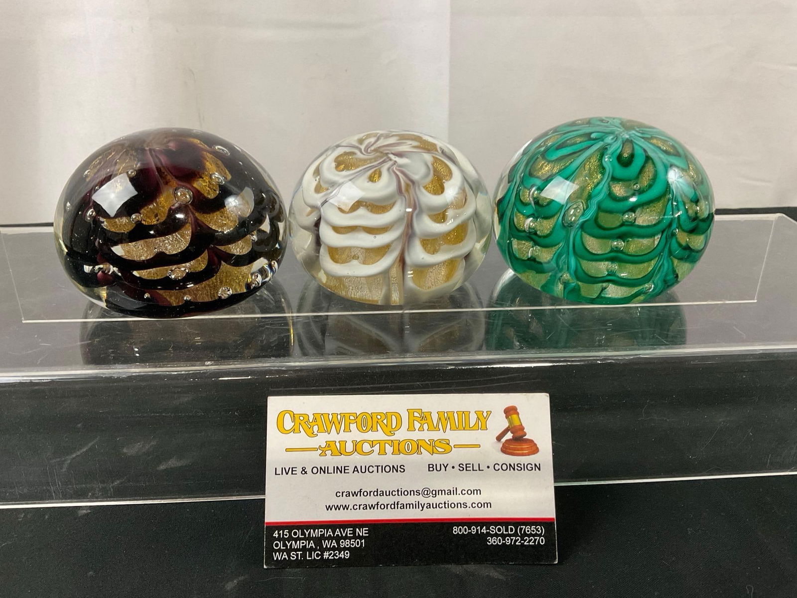 Trio of Acker And Jablow Glass Paperweights, Murano Glass, Black, White & Teal w/ Gold flakes under: Appears to be in good shape, some scratches on the bottom of the pieces. The pieces measure approx 2h x 3.5d inches, they are marked on the bottom 218 w. 40th St. Acker & Jablow. See pics. E-2701