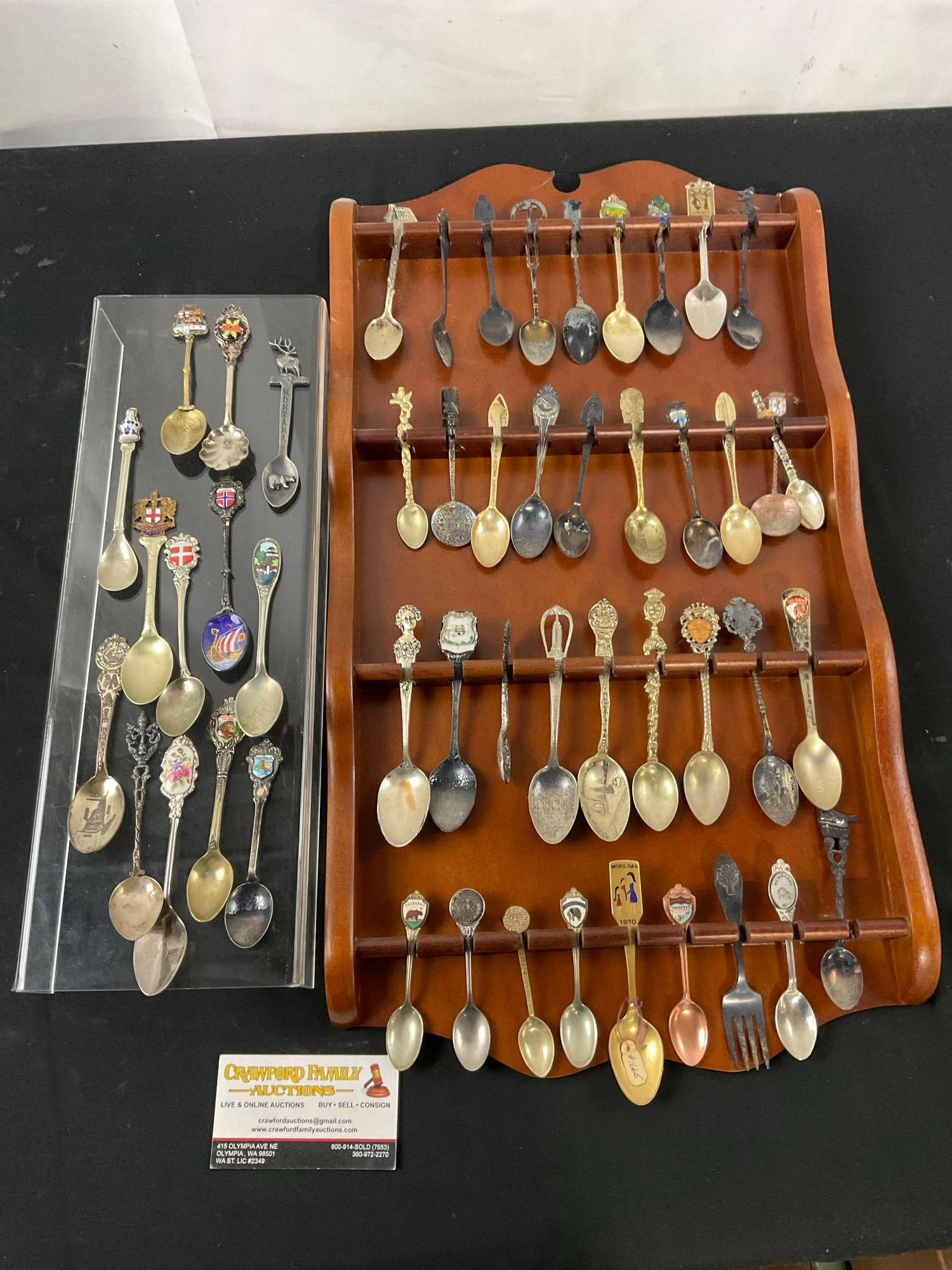 Collectible Spoon Holder with a variety of Spoons incl. some Sterling pieces w/ some extras: The spoons are unresearched, a couple are pictured as sterling. The wooden wall hanging measures approx 20.5h x 12w inches. See pics. E-2718