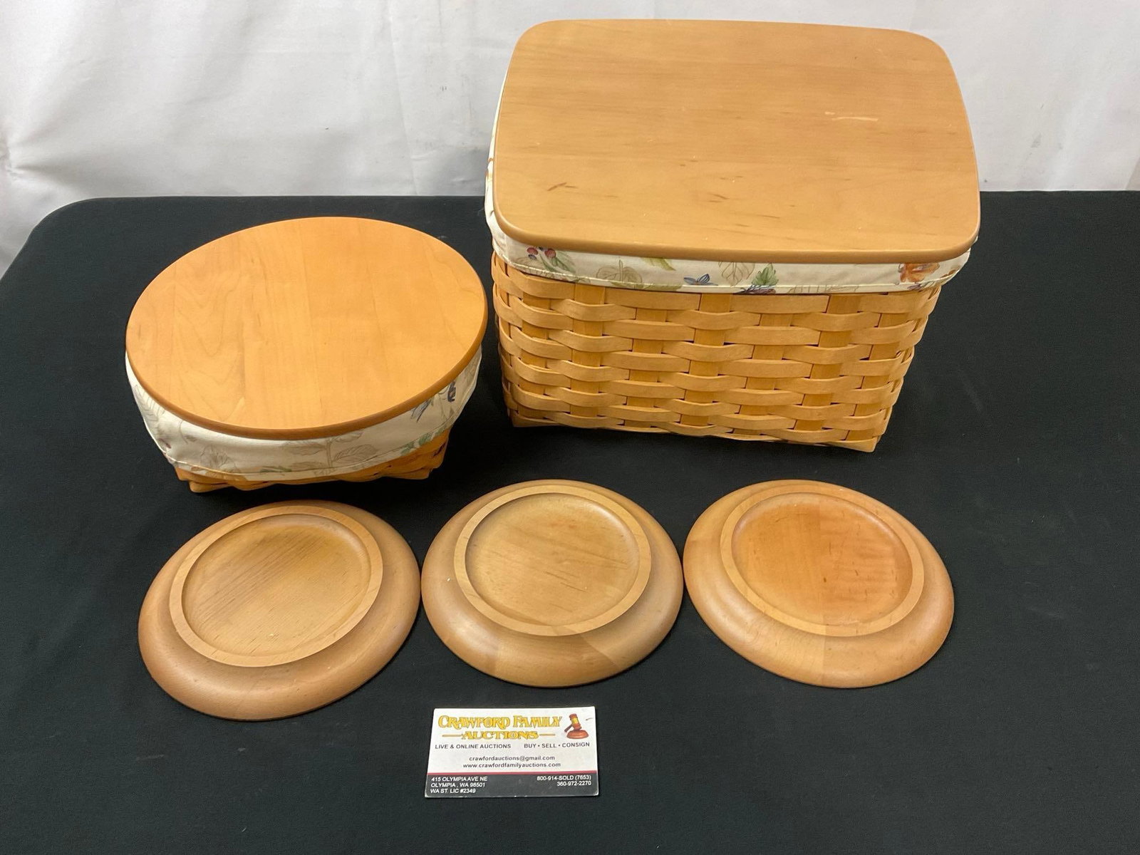 Pair of Signed Longaberger Baskets w/ Lids, and three circular wooden stands (1 of 4)